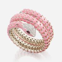 An enamel, white gold plated sterling silver, diamond, and ruby bangle