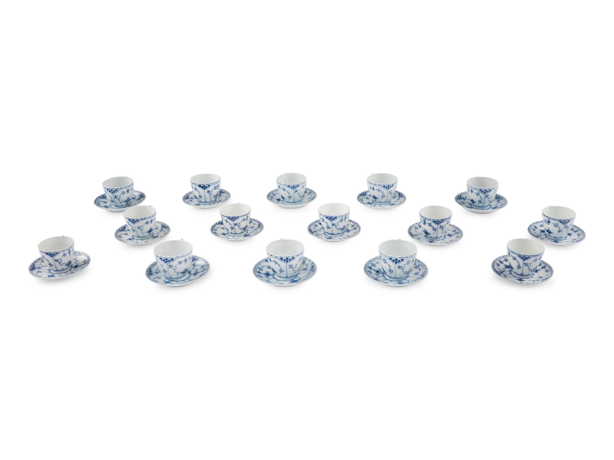 A Group of Royal Copenhagen Blue Fluted Teacups and Saucers