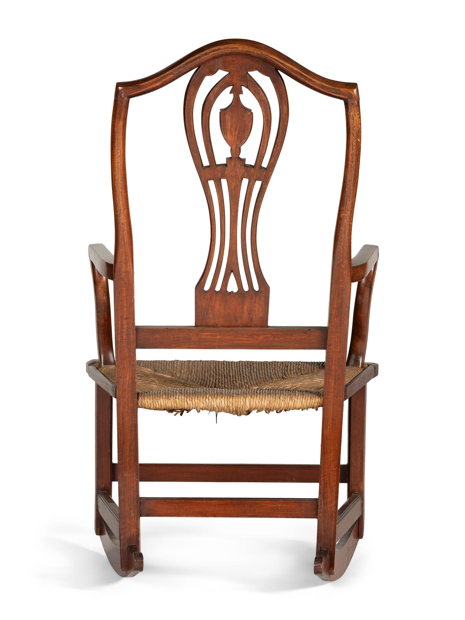 A Federal Heart and Urn Carved Mahogany Rush-Seat Rocking Chair