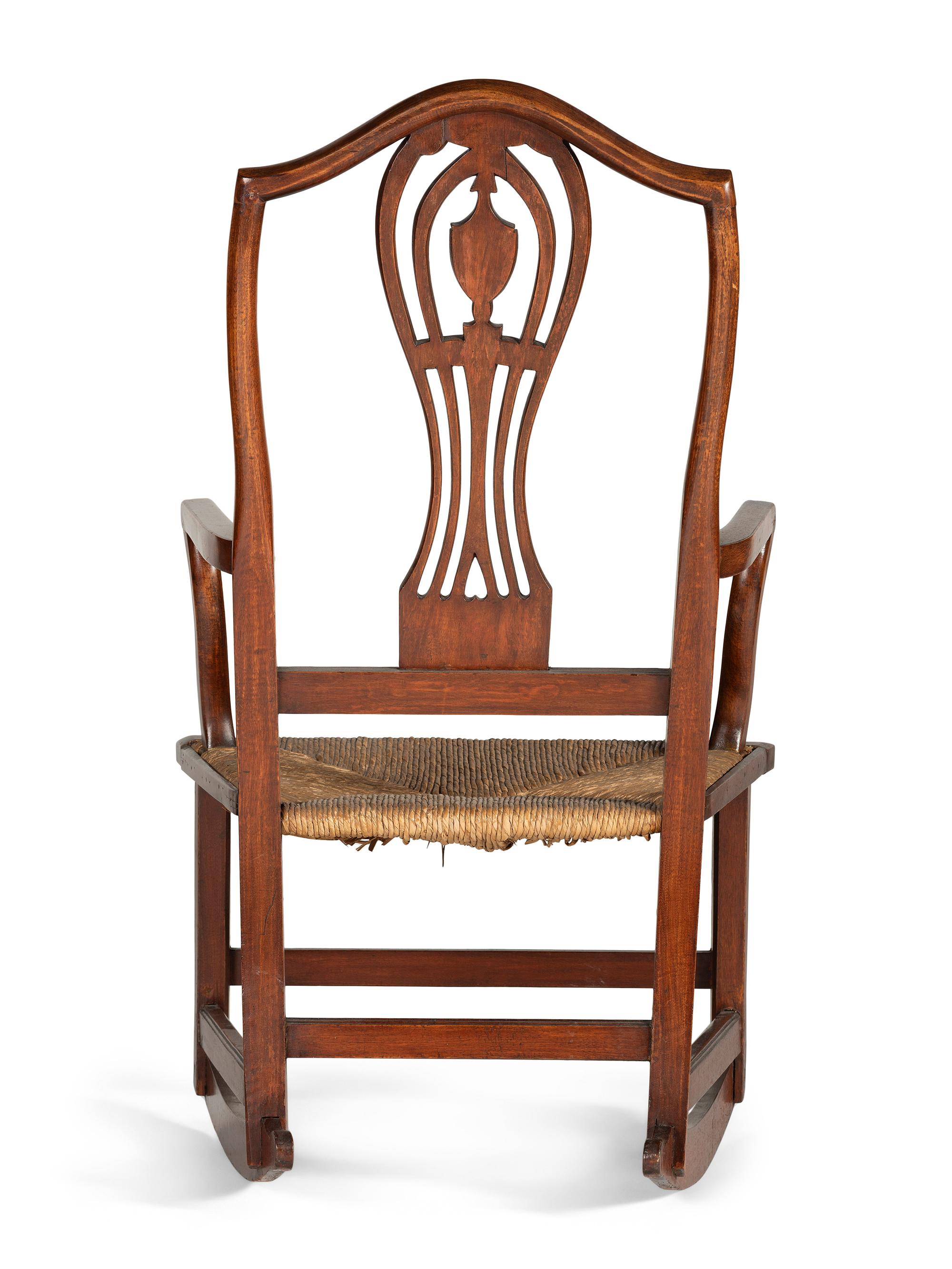 A Federal Heart and Urn Carved Mahogany Rush-Seat Rocking Chair