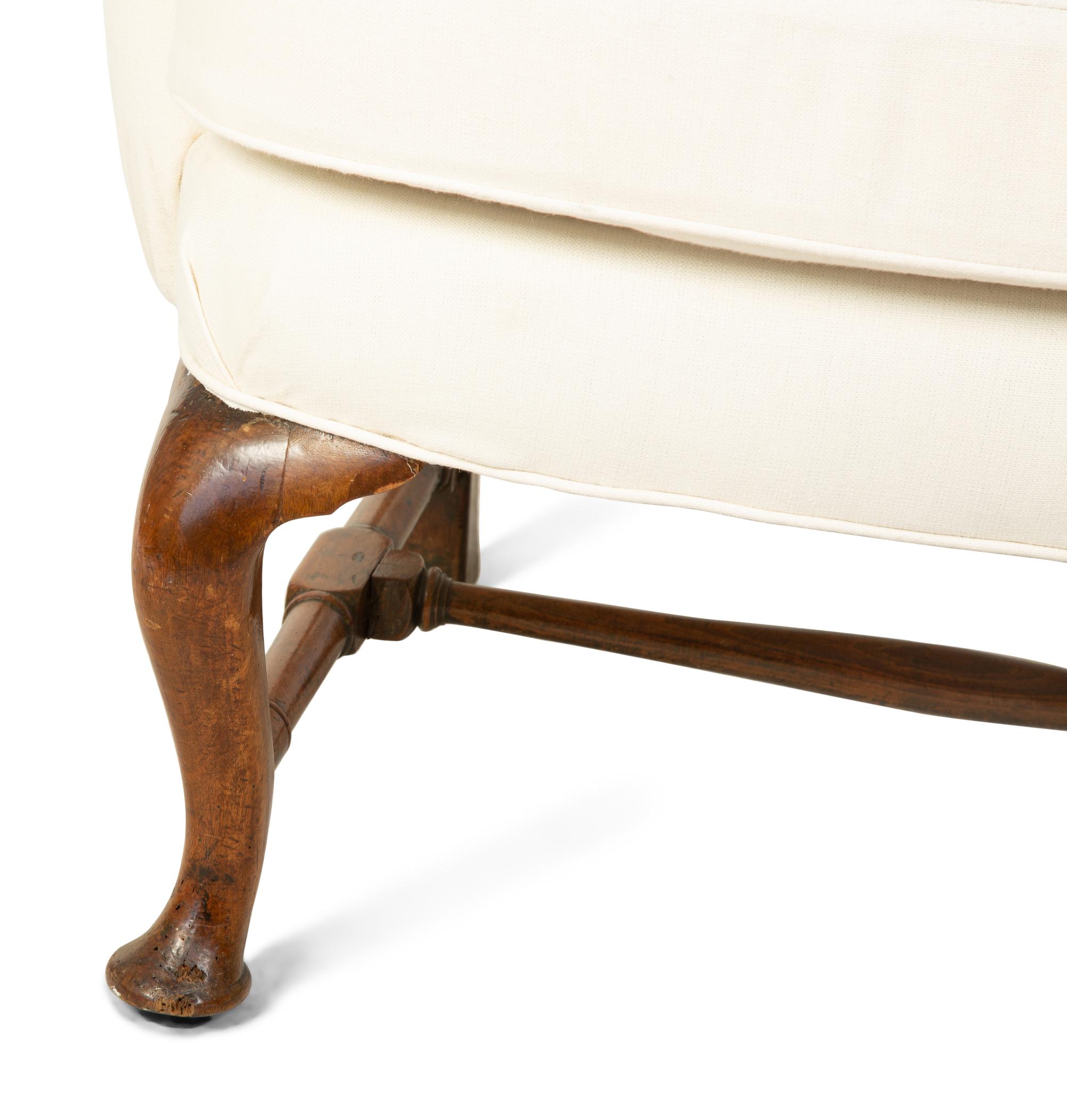A Queen Anne Style Wingback Armchair — 18TH CENTURY