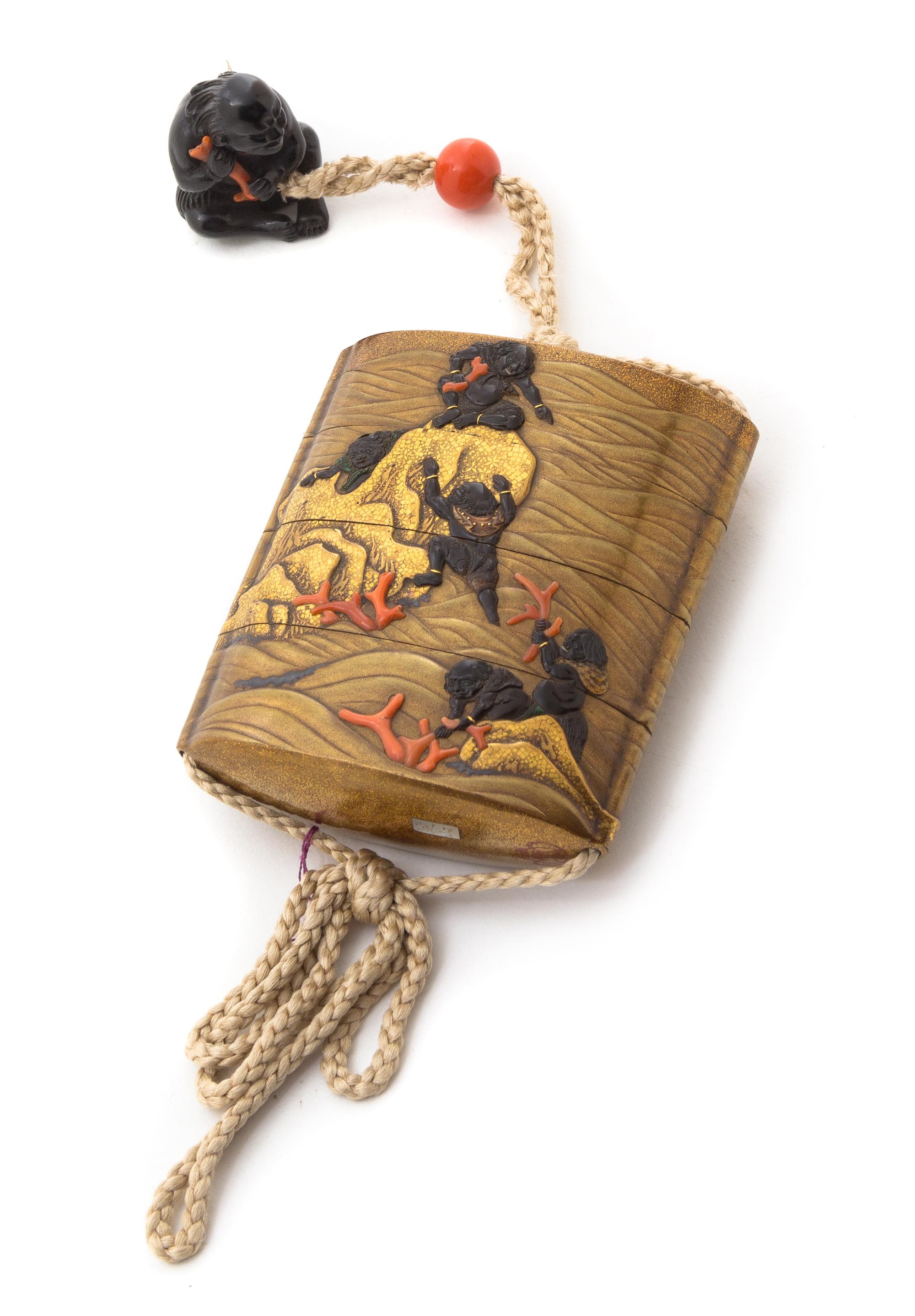 A Coral Inlaid Gilt and Black Lacquer Three-Case Inro Height 3 1/2 inches.
