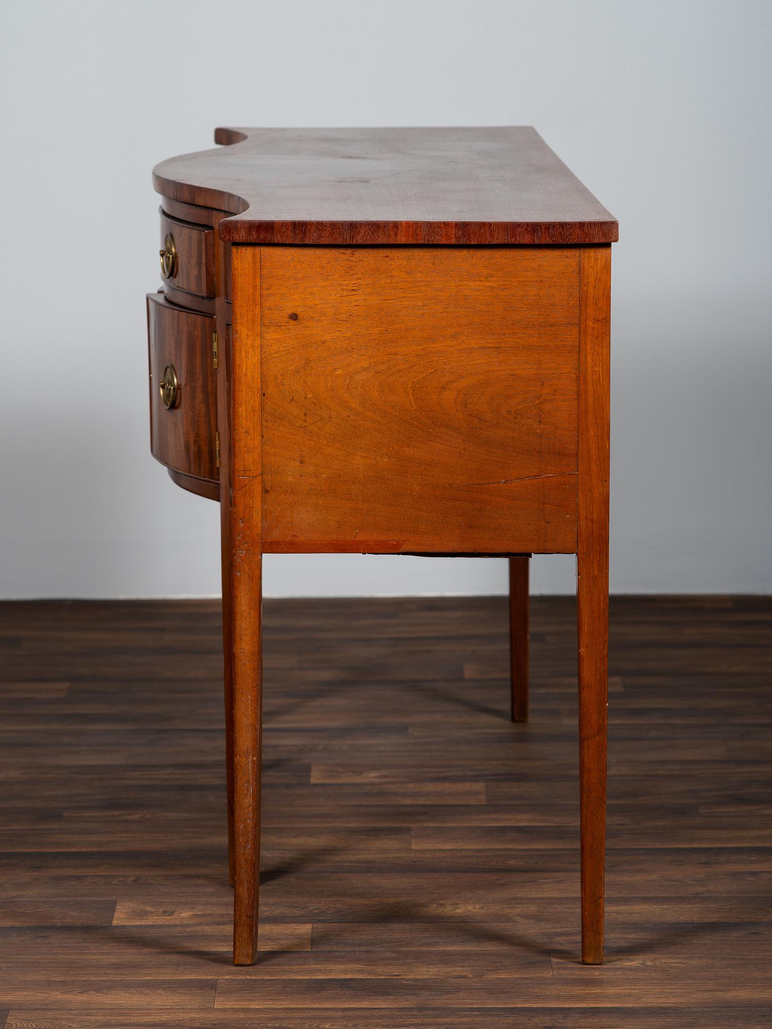 A Federal Figured Mahogany Serpentine Sideboard