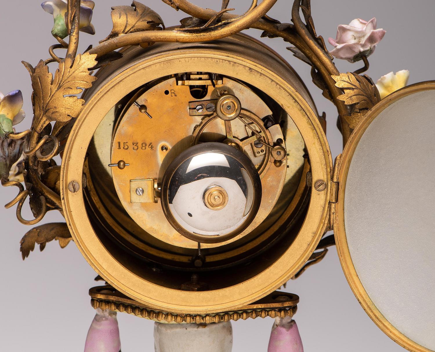 A French Gilt Bronze and Porcelain Mantel Clock