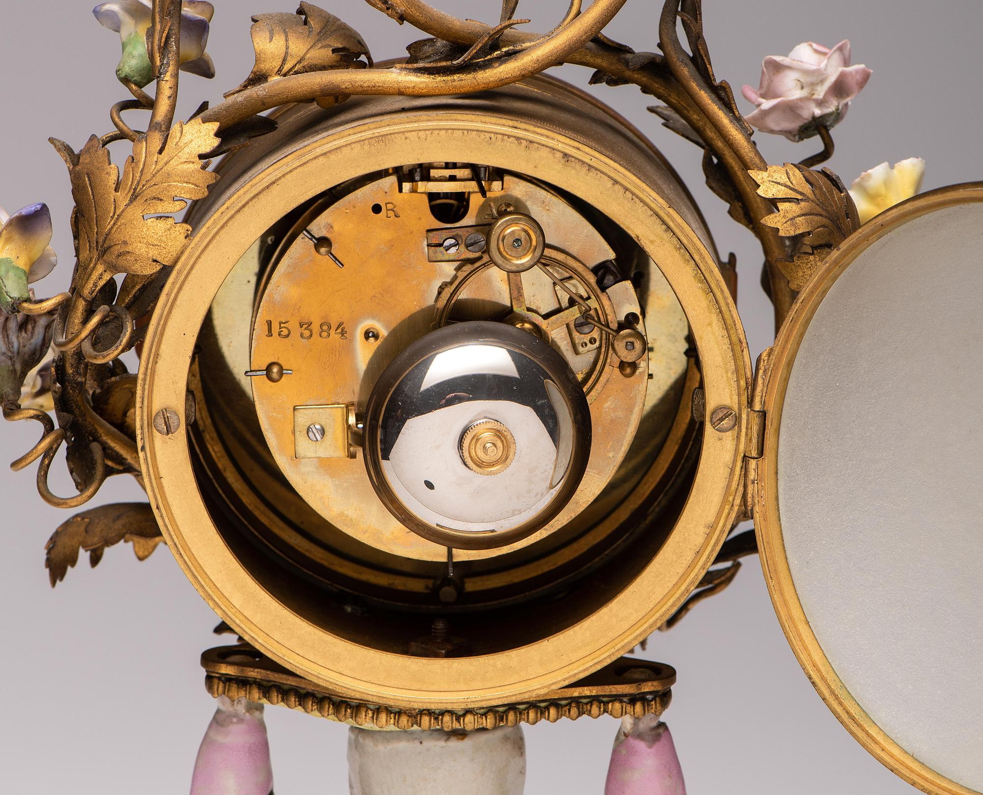 A French Gilt Bronze and Porcelain Mantel Clock