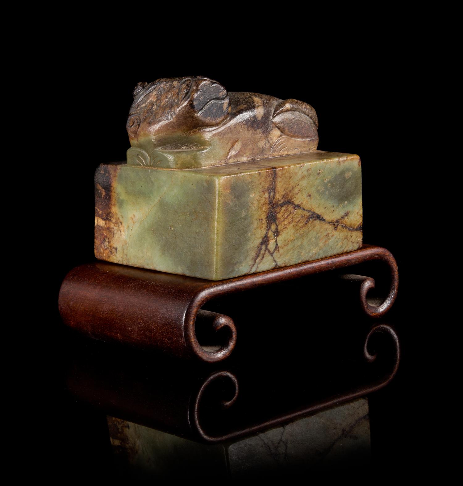 A Large Green and Brown Jade Seal Height 3 1/4 x width 3 1/4 inches.