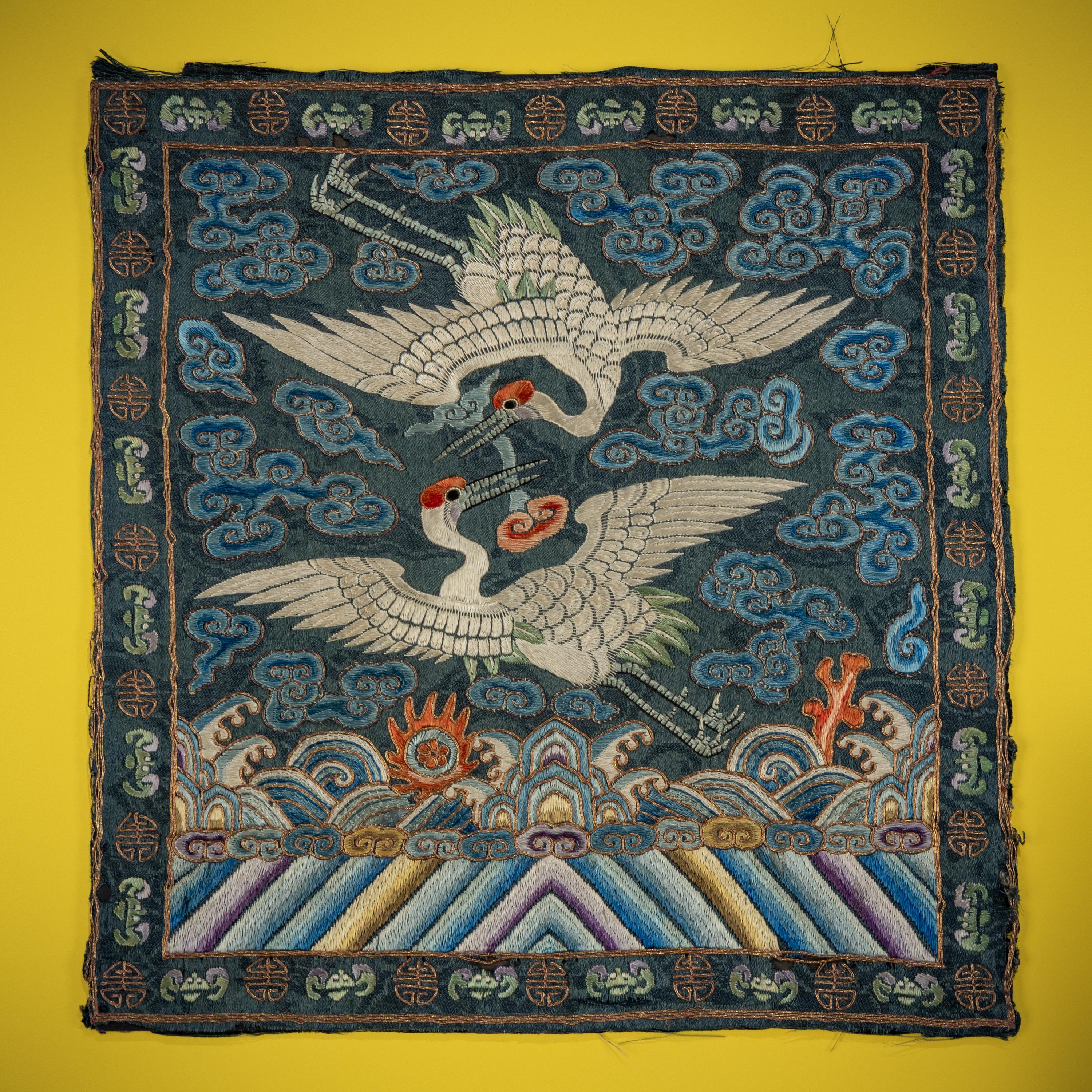 A Pair of Korean Embroidered Silk 'Double Crane' Rank Badges and a Vietnamese Salmon Pink Ground Embroidered Silk 'Crane' Rank Badge, Late 19th Century — 十九世紀晚期 朝鮮王朝文官鶴紋補子一對及越南鶴紋補子