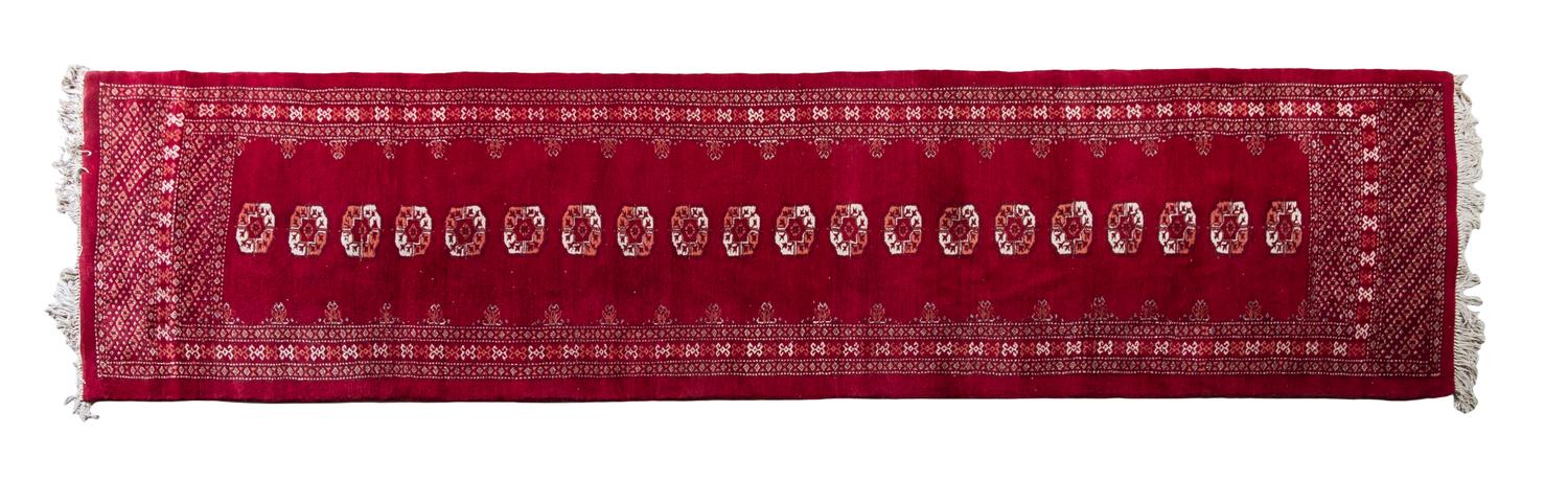 A Bokhara Wool Runner 11 feet 7 inches x 2 feet 11 inches.