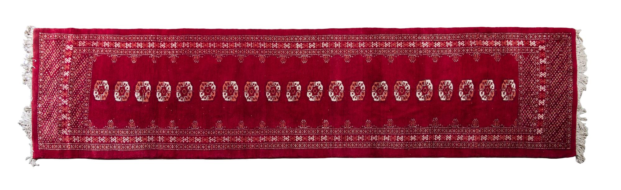 A Bokhara Wool Runner 11 feet 7 inches x 2 feet 11 inches.
