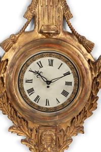 A Louis XVI Style Giltwood Cartel Clock