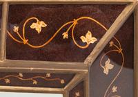 An Eglomisé Decorated Mirror