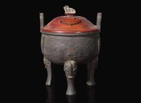 A large Chinese patinated bronze archaistic tripod censer, Ding, and wood cover, The Bronze 17th/18th Century or Earlier 清 青銅鼎式爐