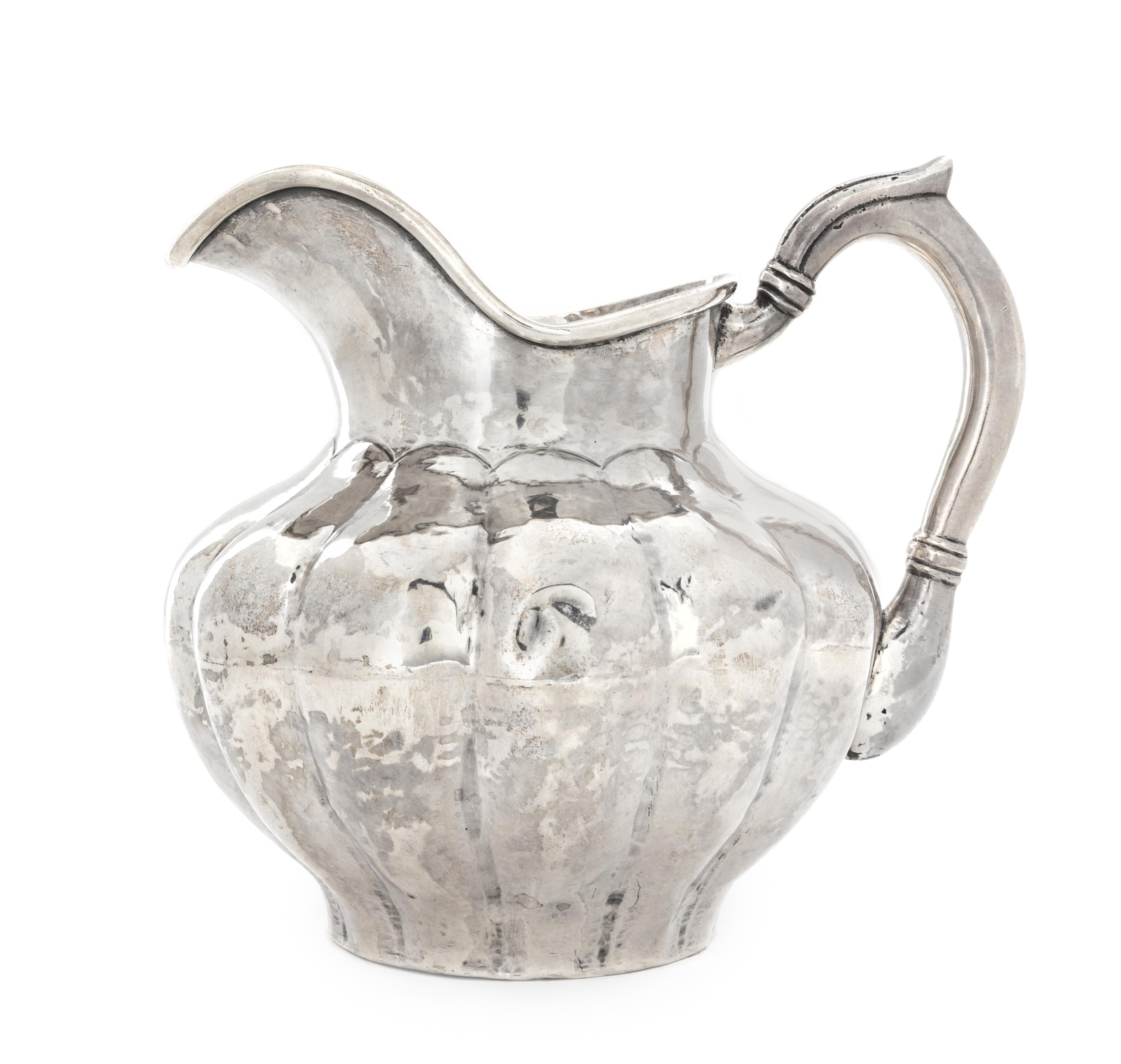 A Peruvian Silver Water Pitcher, Carlos Jimenez, Cusco, of lobed, baluster form.