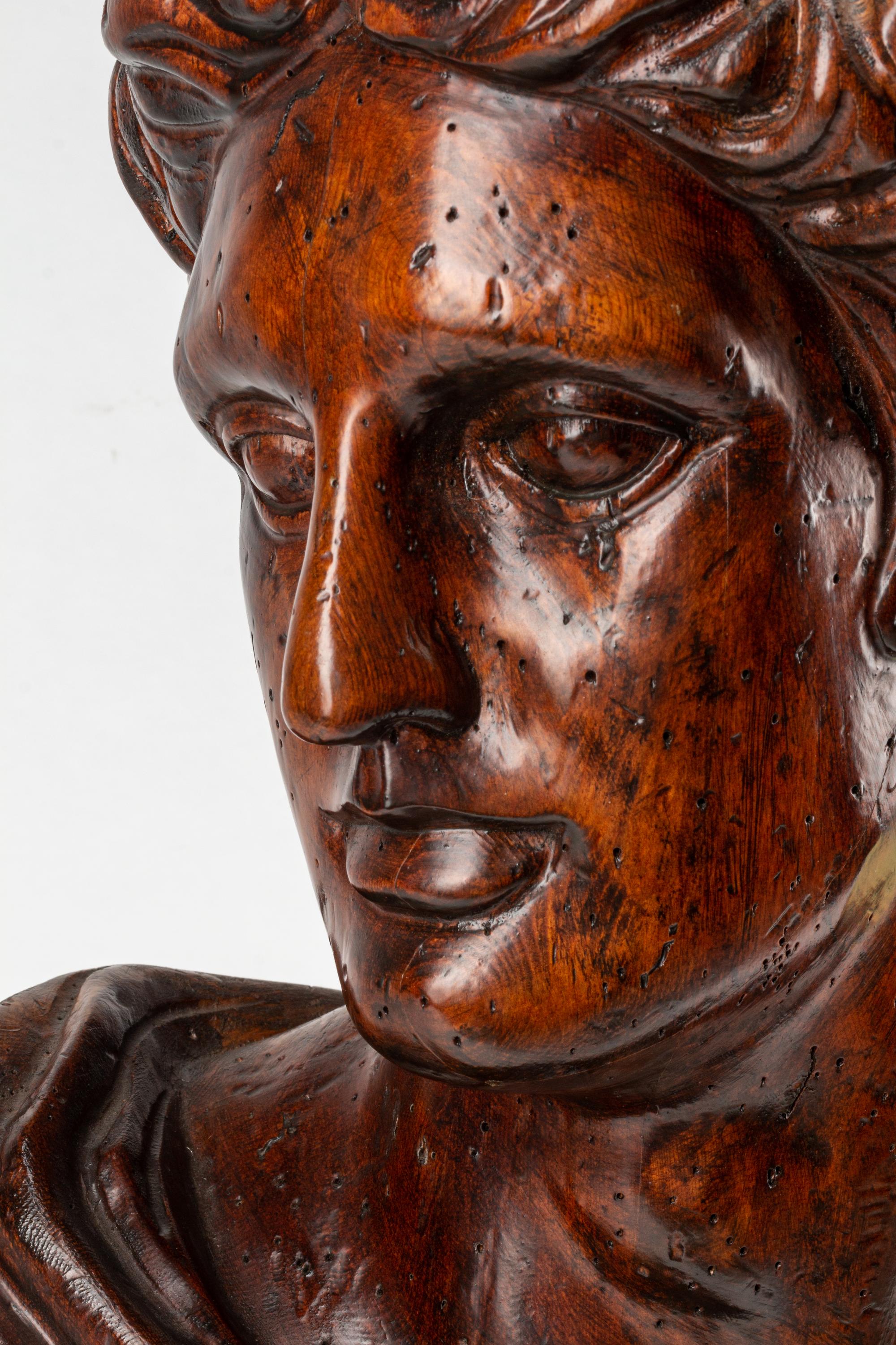 An Italian Carved Wood Bust of a Roman