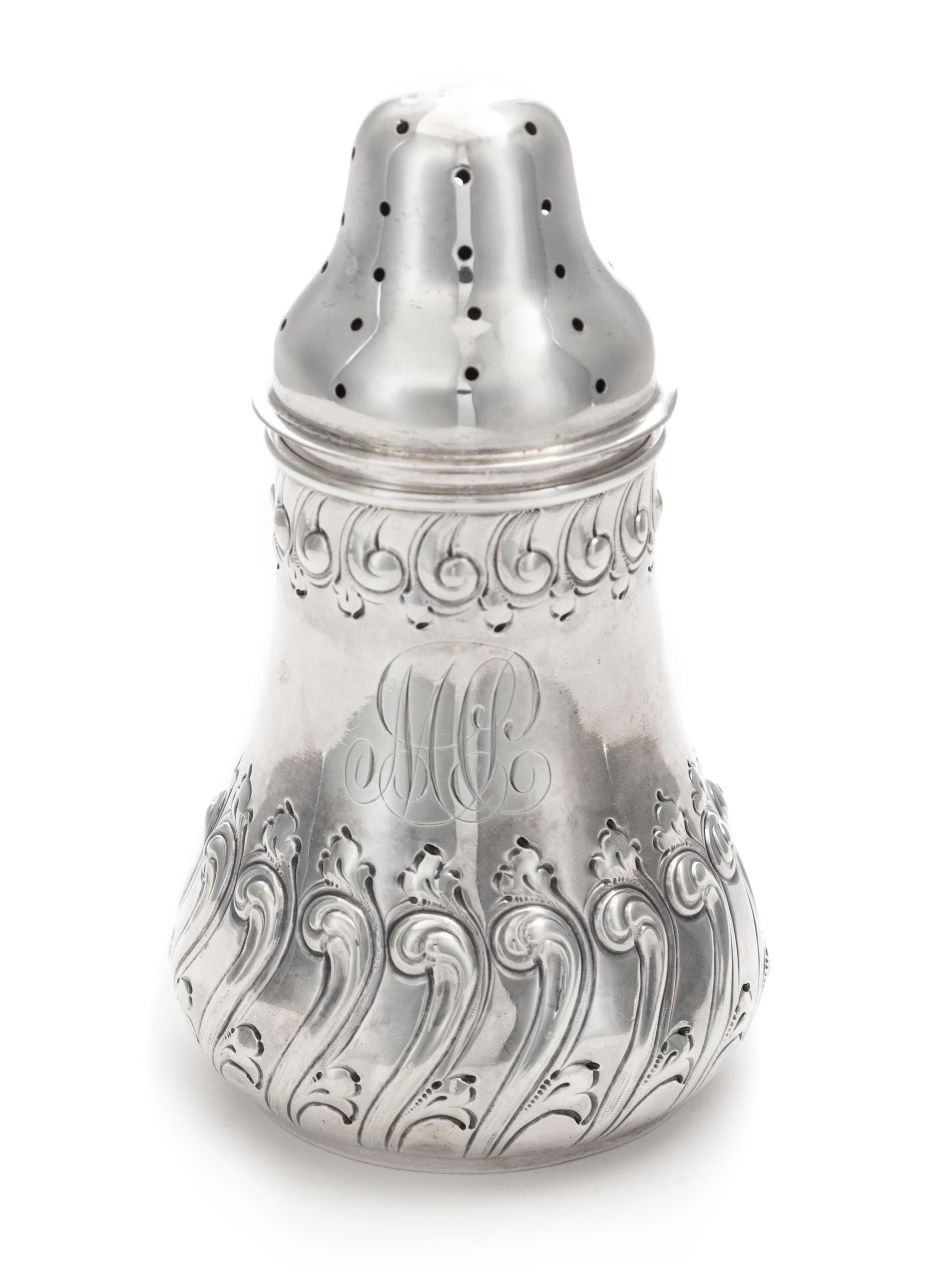 An American Silver Muffineer, Dominick & Haff, New York, NY, 1889, the body worked with S-scrolls.