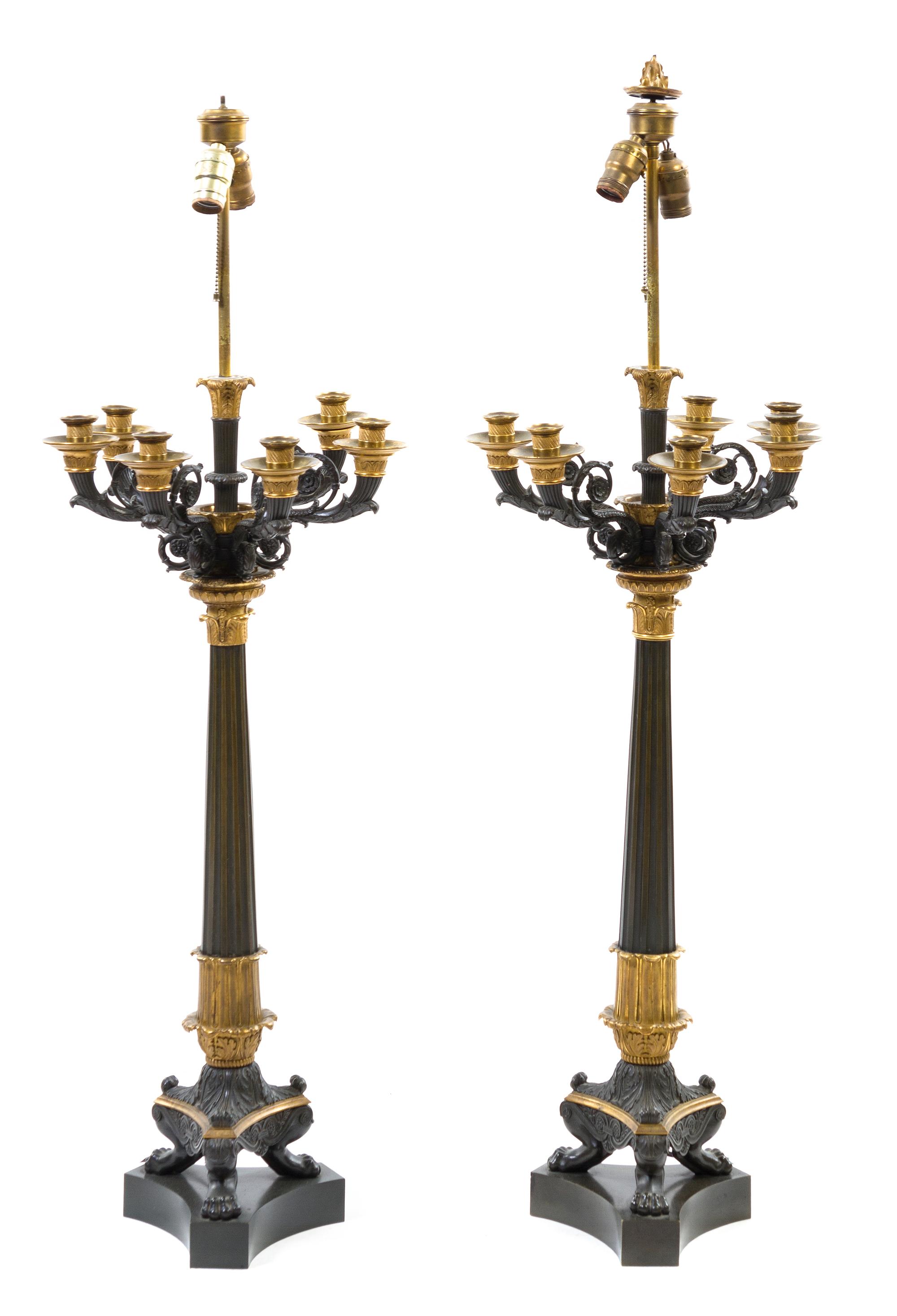 A Pair of Napoleon III Gilt and Patinated Bronze Eight-Light Candelabra, Height overall 45 1/2 inches.