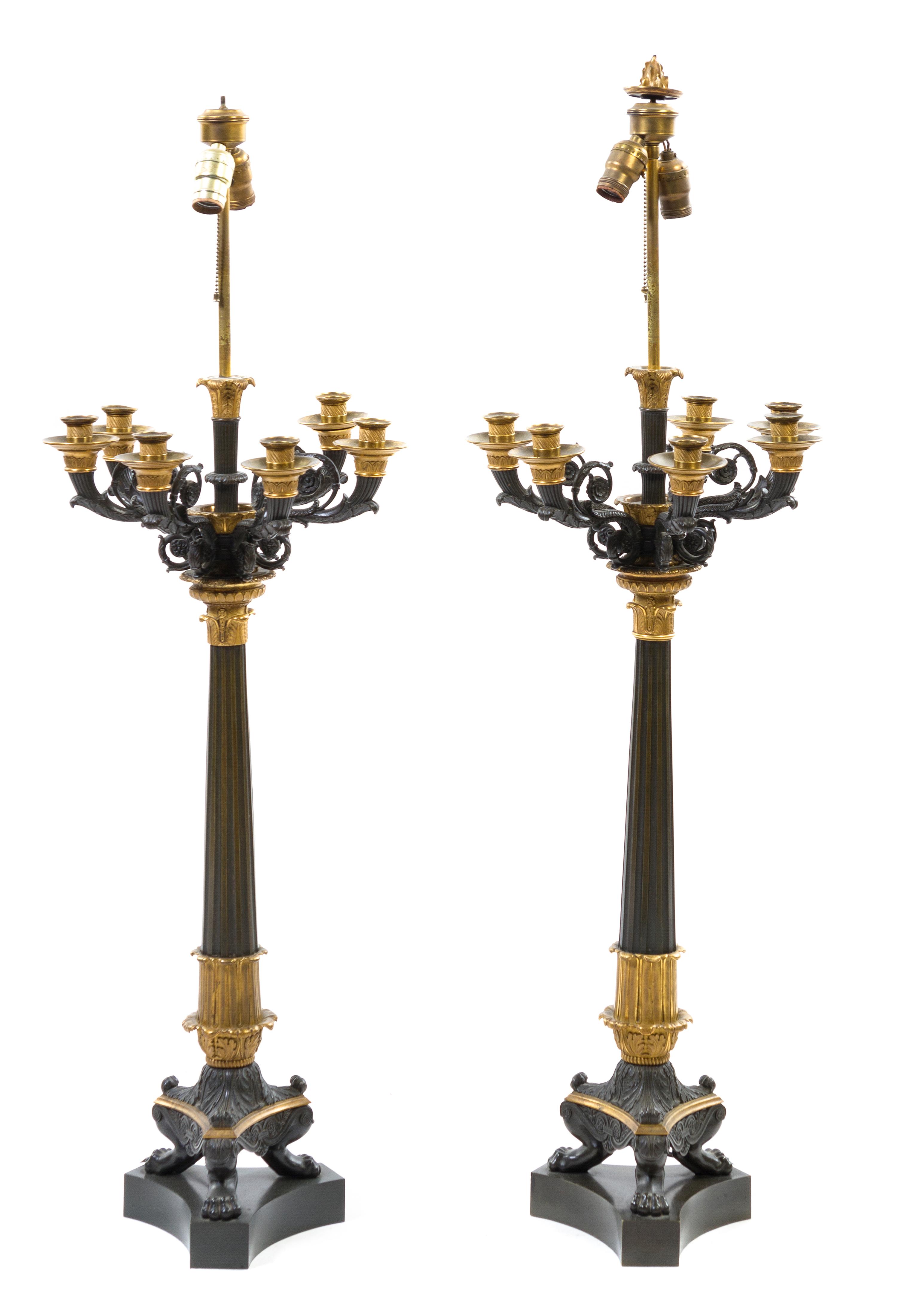 A Pair of Napoleon III Gilt and Patinated Bronze Eight-Light Candelabra, Height overall 45 1/2 inches.