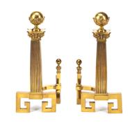 A Pair of Continental Gilt Metal Chenets Height 29 inches.