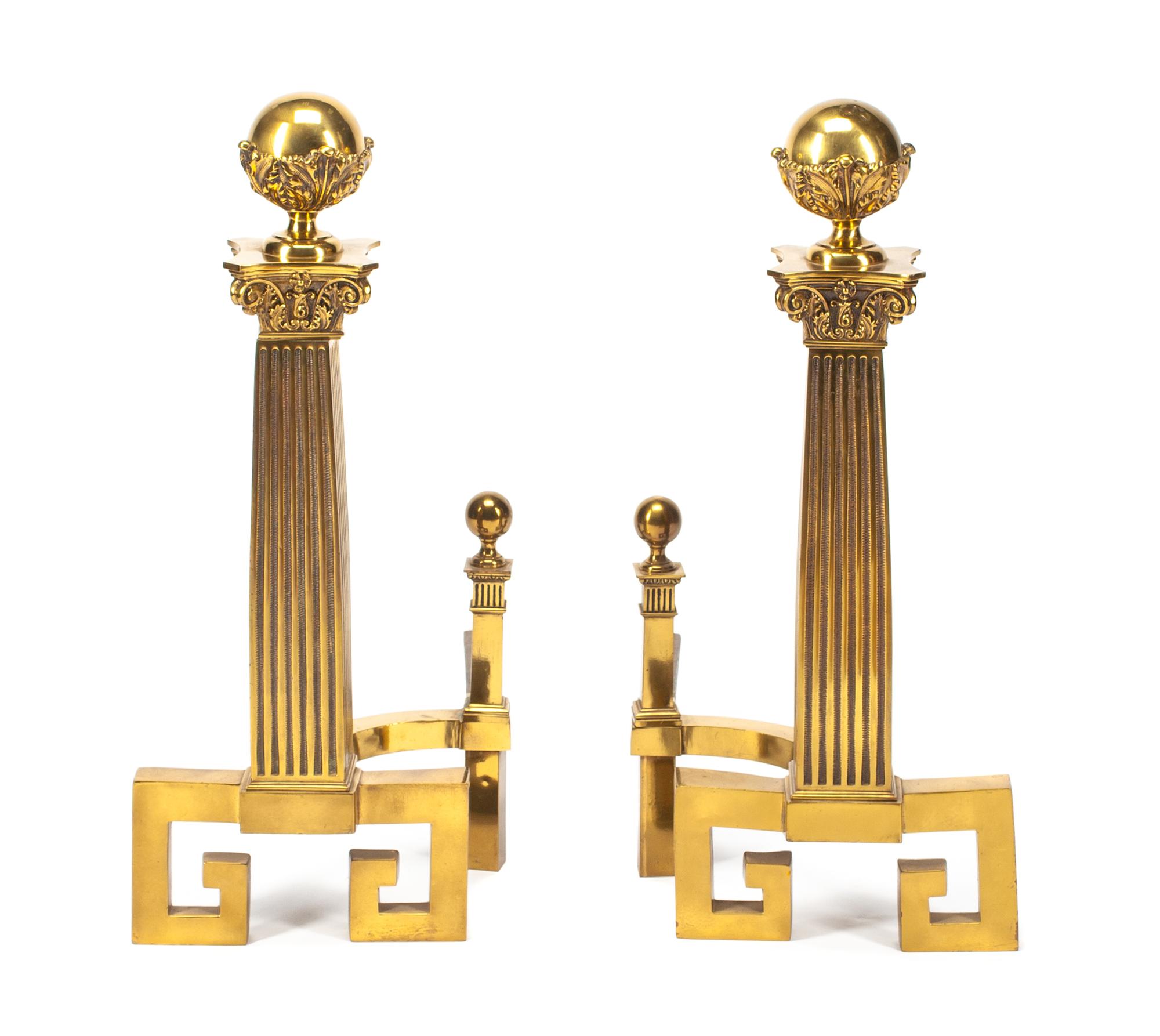 A Pair of Continental Gilt Metal Chenets Height 29 inches.