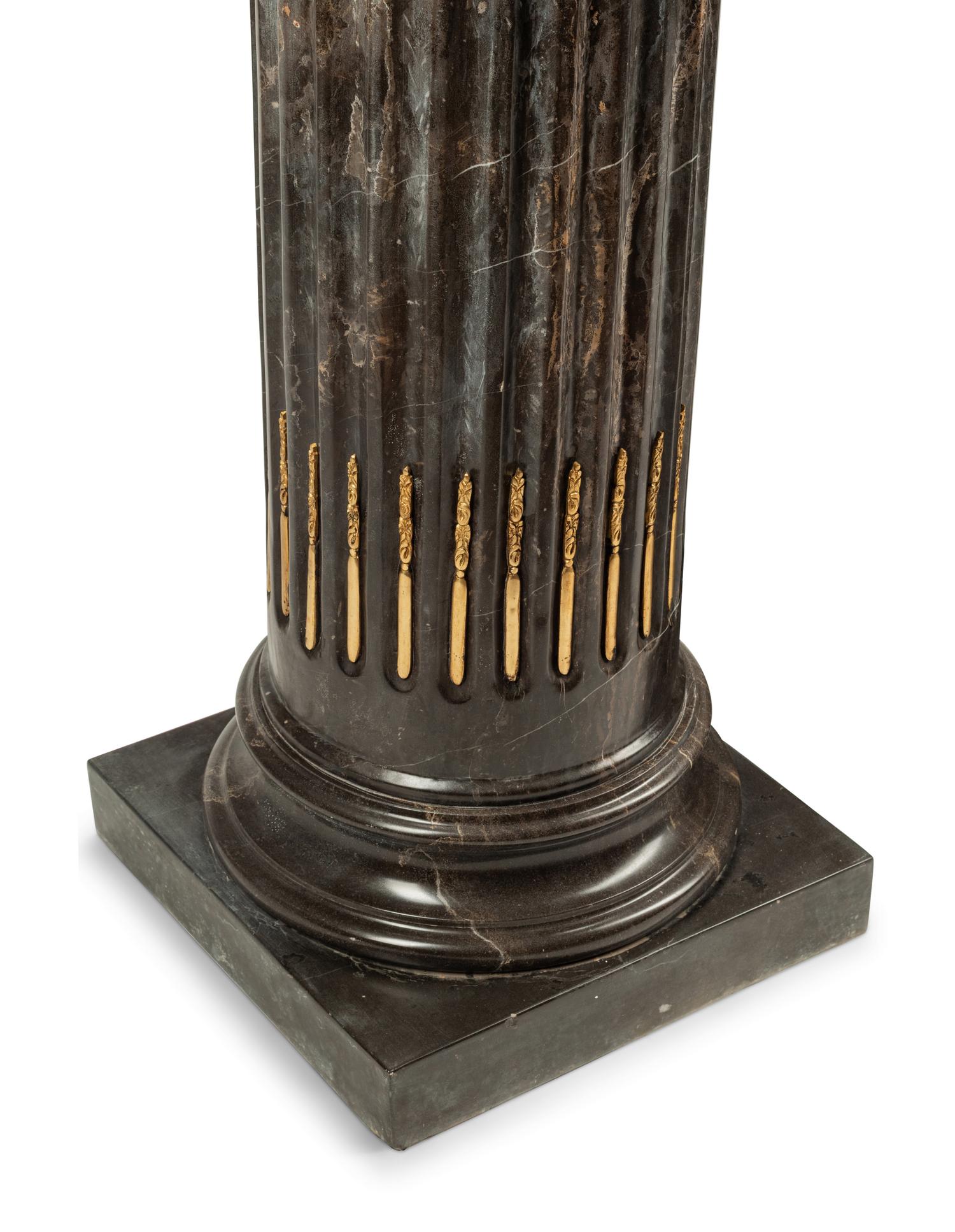 A Pair of Bronze Mounted Marble Pedestals