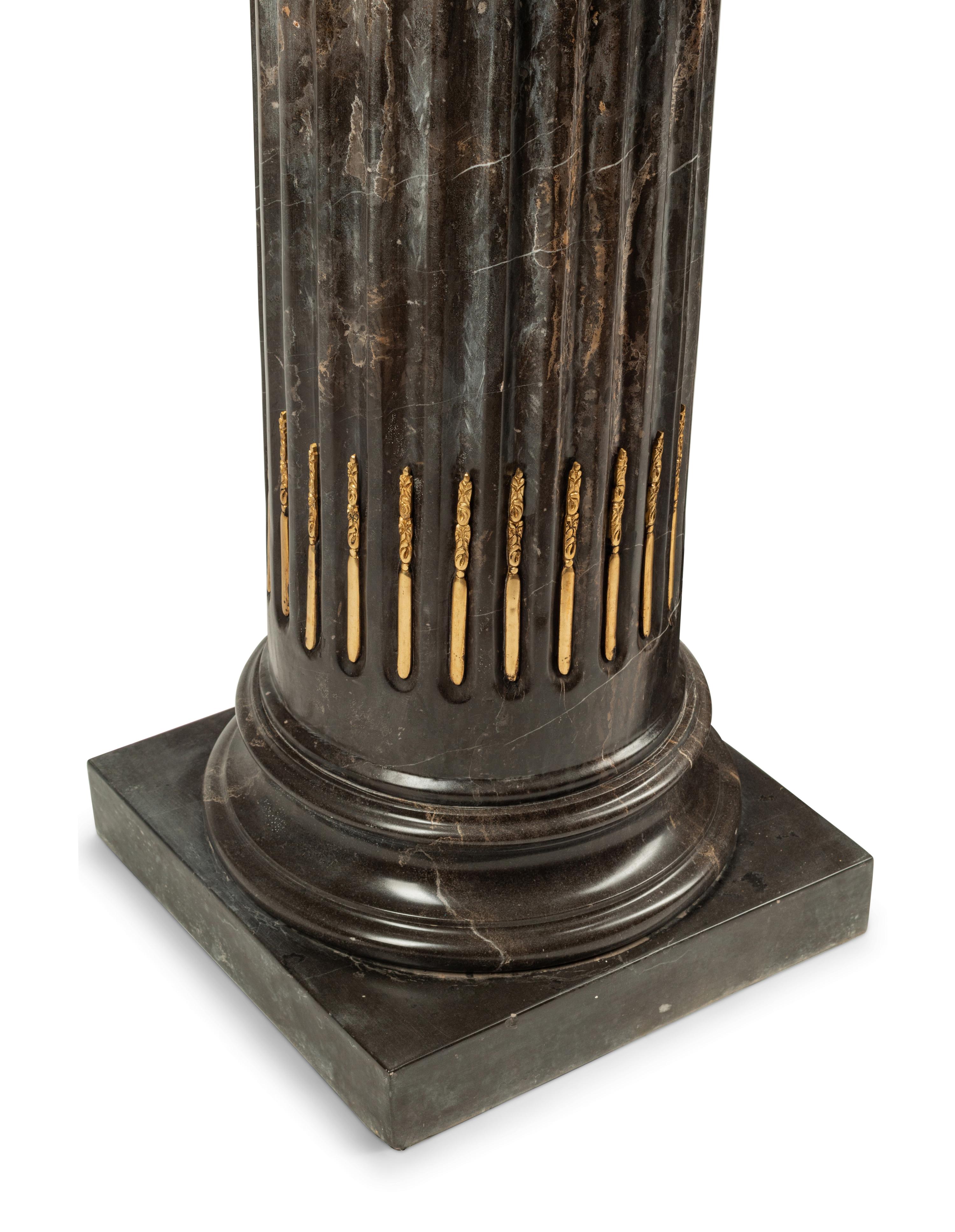 A Pair of Bronze Mounted Marble Pedestals