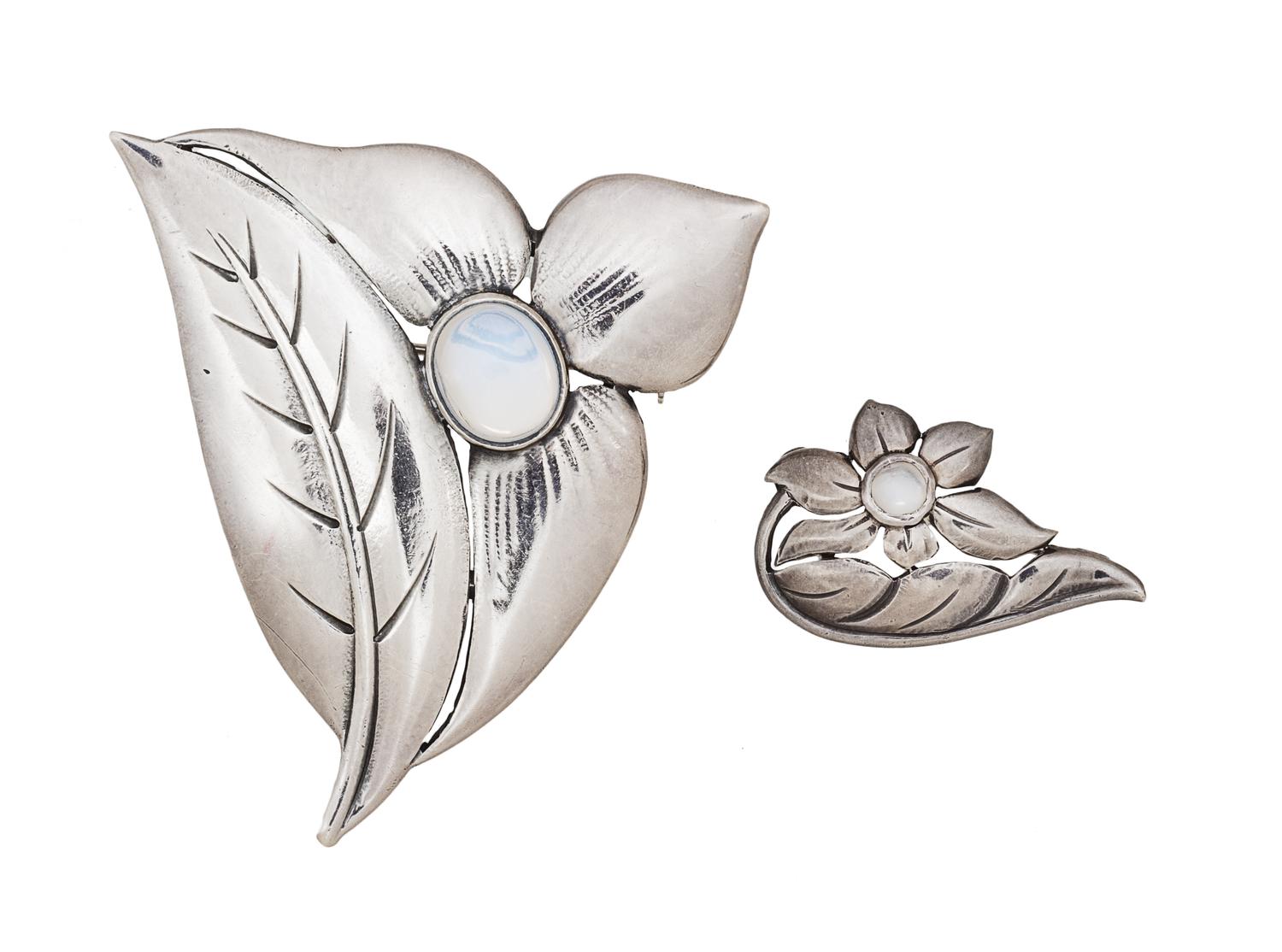 A Collection of Sterling Silver and Moonstone Flower Brooch, Georg Jensen USA, 14.20 dwts.