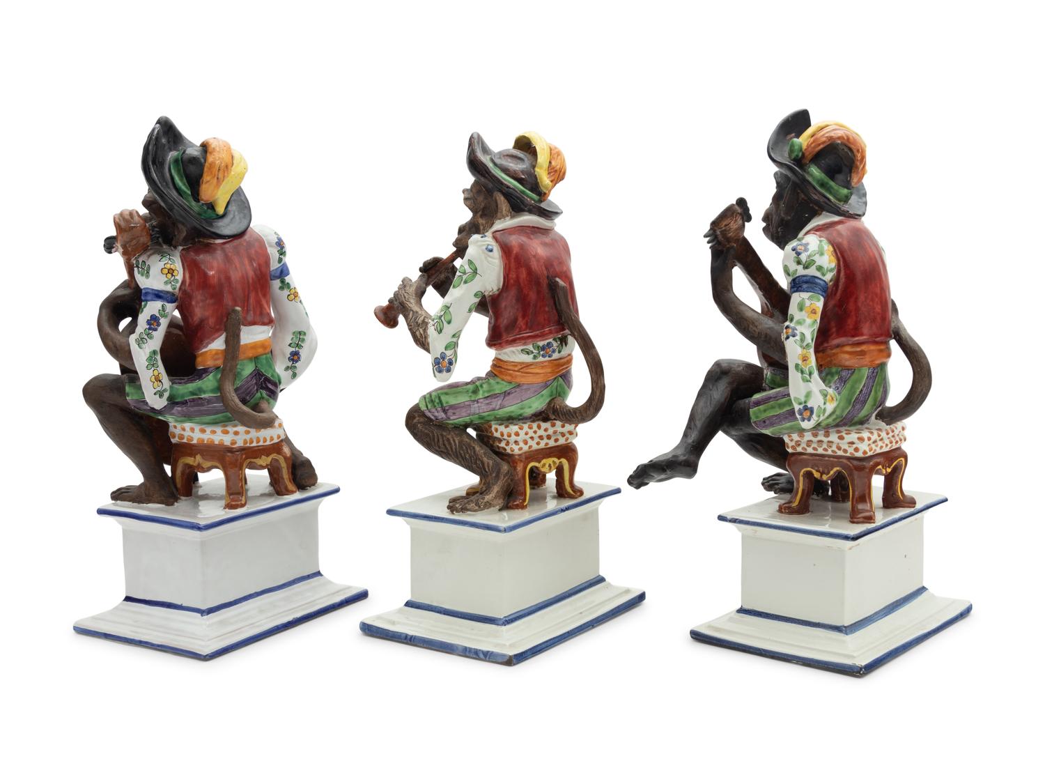 A Set of Three Italian Majolica Monkey Band Figures