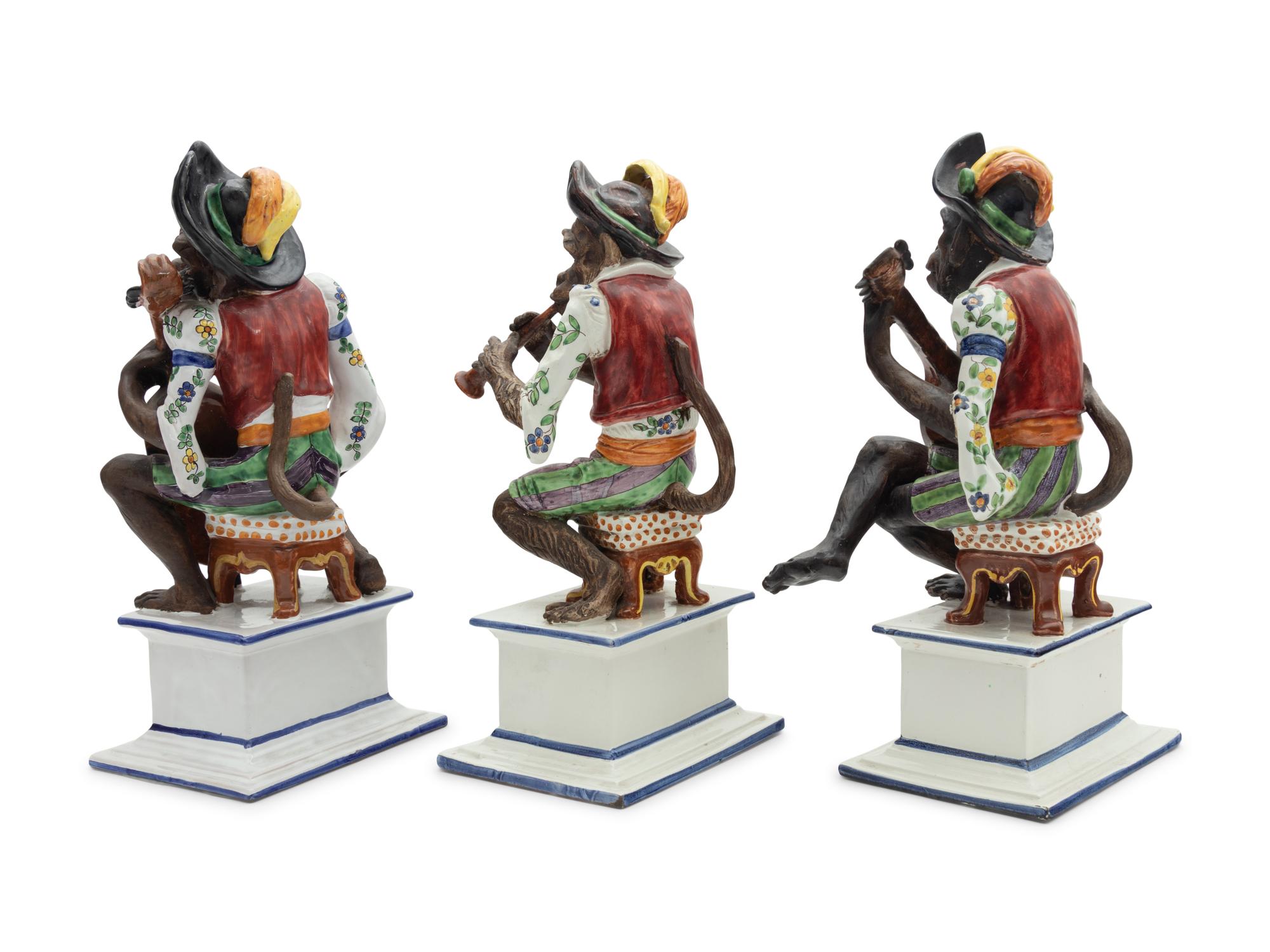 A Set of Three Italian Majolica Monkey Band Figures