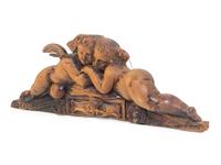 A French Carved Walnut Figural Overdoor Panel