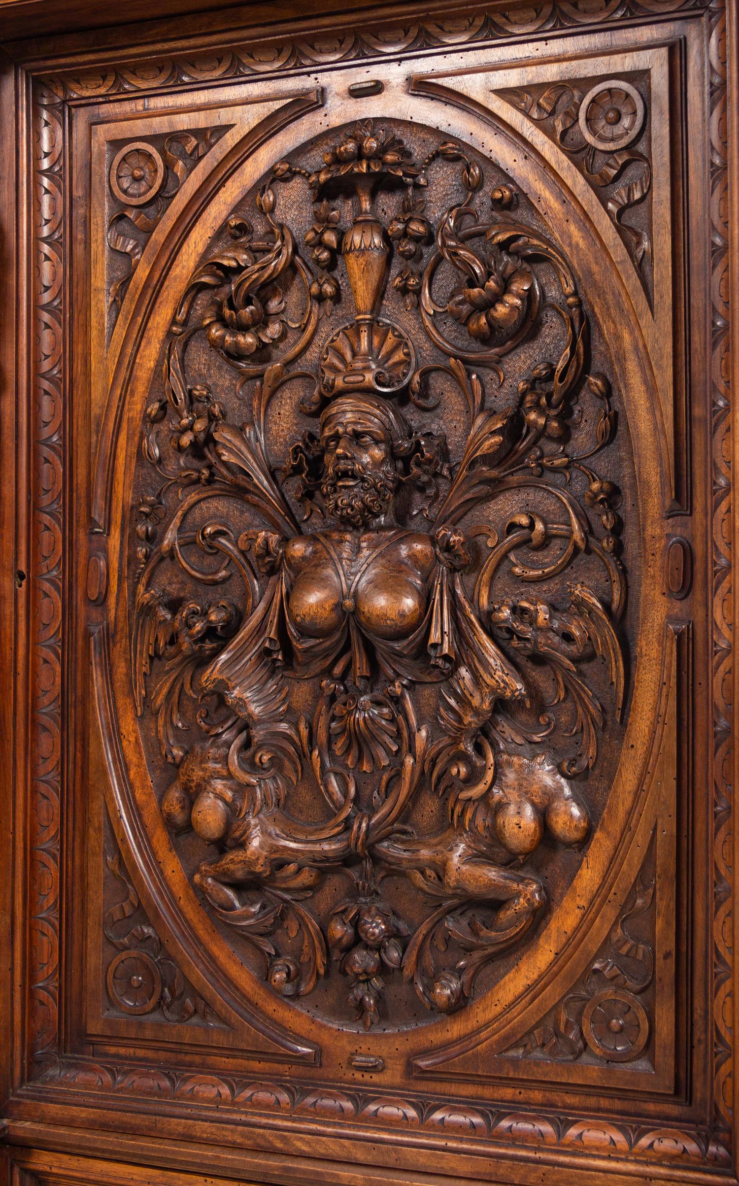 A Pair of Renaissance Revival Carved Walnut Marble-Top Cabinets
