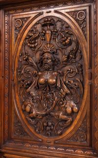 A Pair of Renaissance Revival Carved Walnut Marble-Top Cabinets