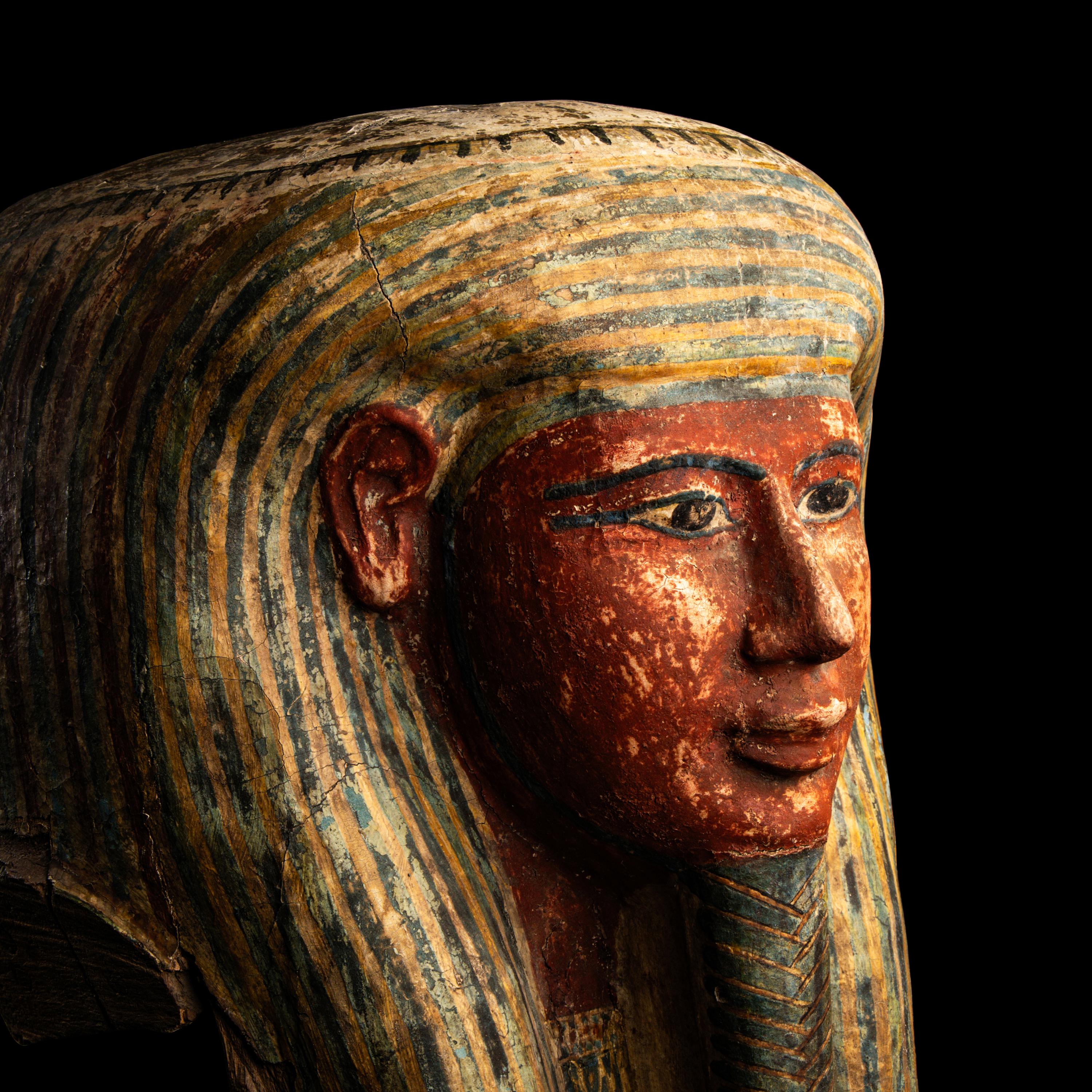 An Egyptian Polychrome Wood Mummy Mask