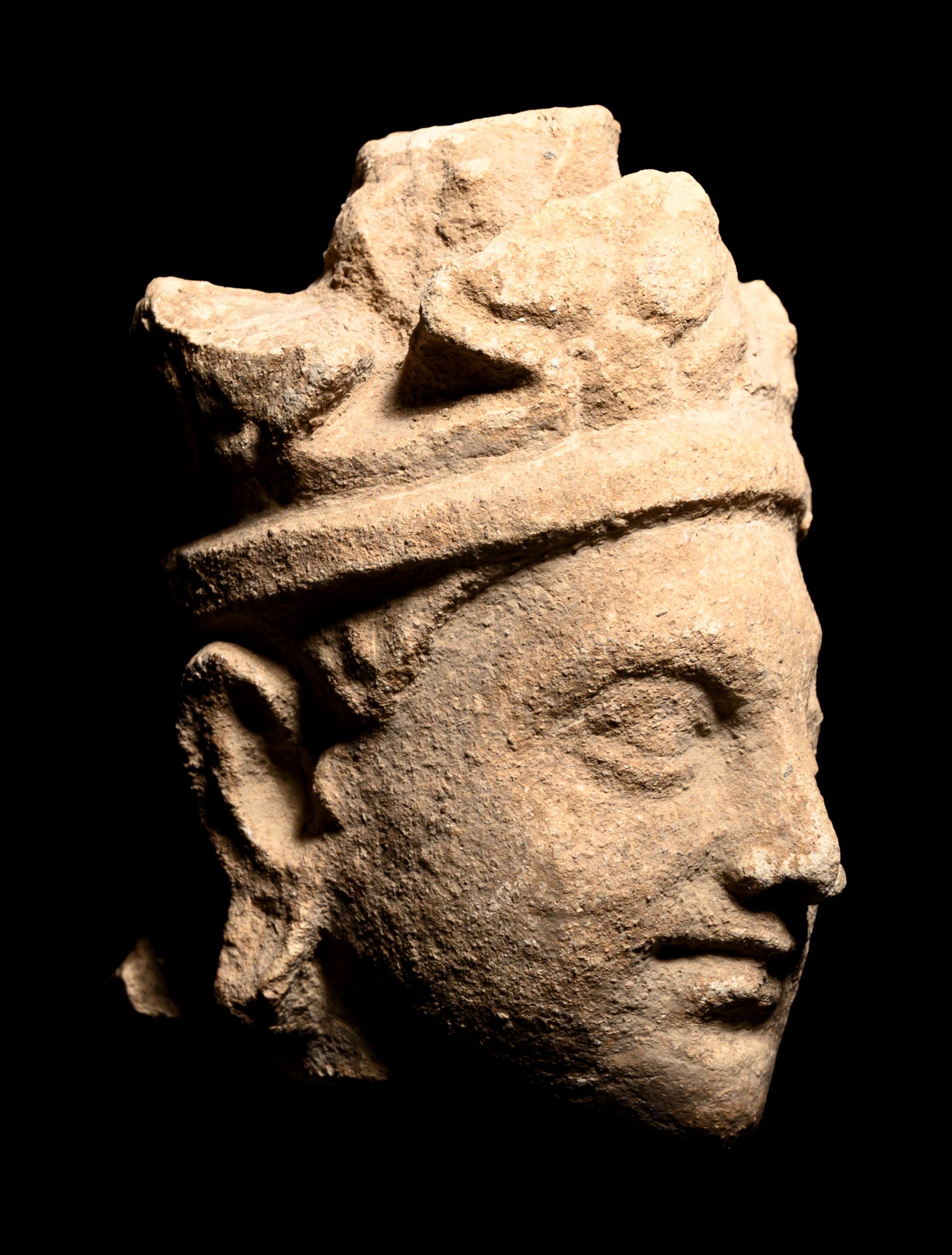 Three Gandharan Fragmentary Stucco Heads and One European Fragmentary Stucco Head