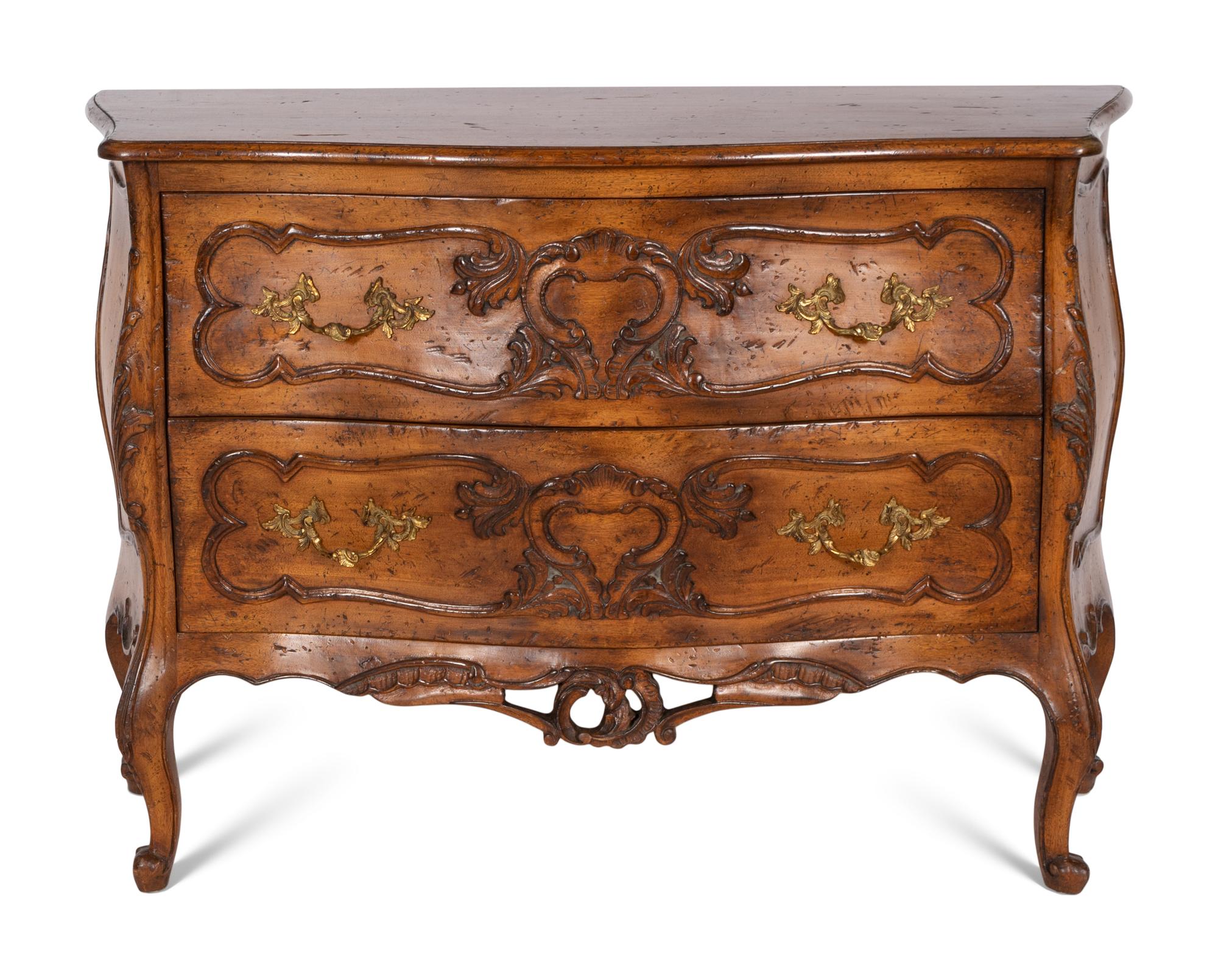 A Pair of Louis XV Style Walnut Bombé Form Commodes