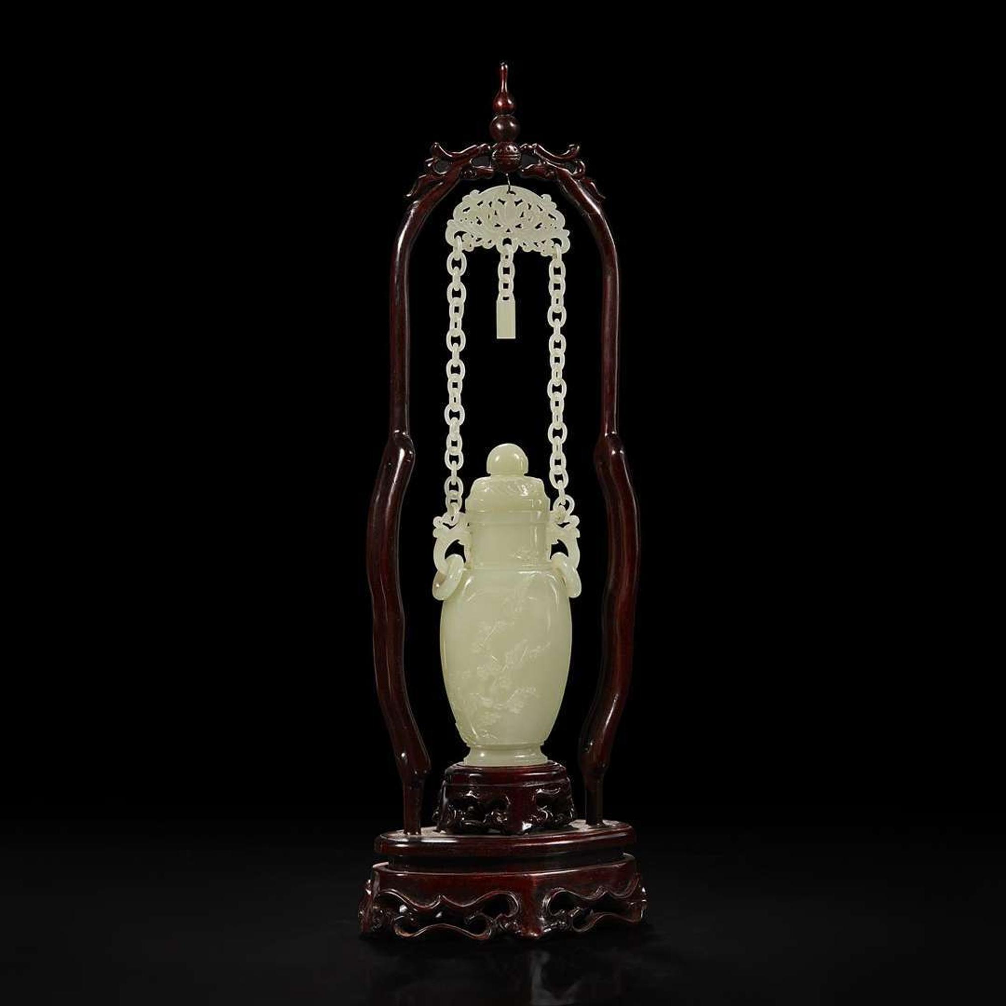 A Chinese pale celadon jade hanging vase and wood stand 白玉吊瓶