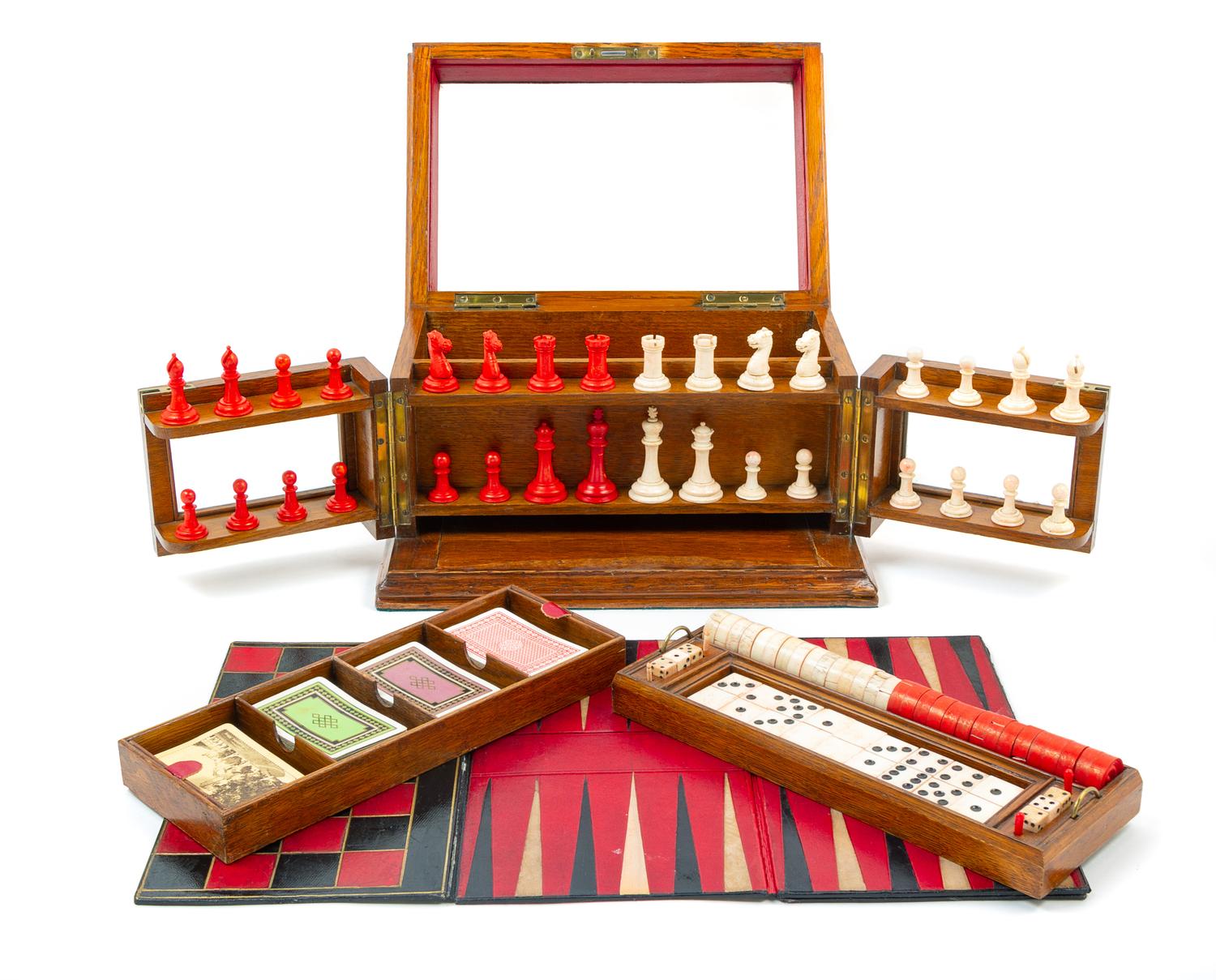 A Victorian Oak Games Compendium Height 7 3/4 x width 13 3/4 x depth 9 5/8 inches. — 19TH CENTURY