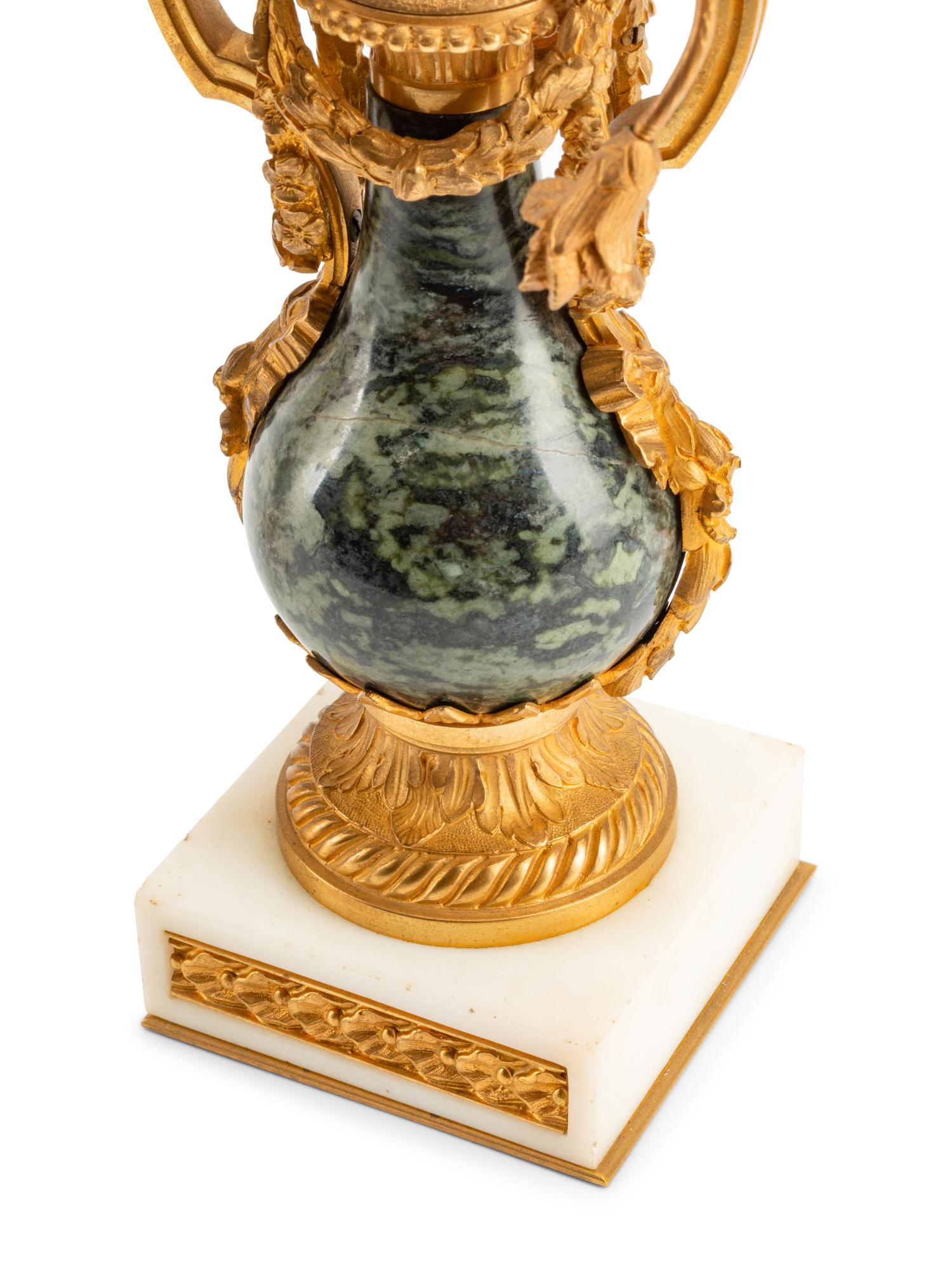 A Pair of French Gilt Bronze and Marble Three-Light Candelabra