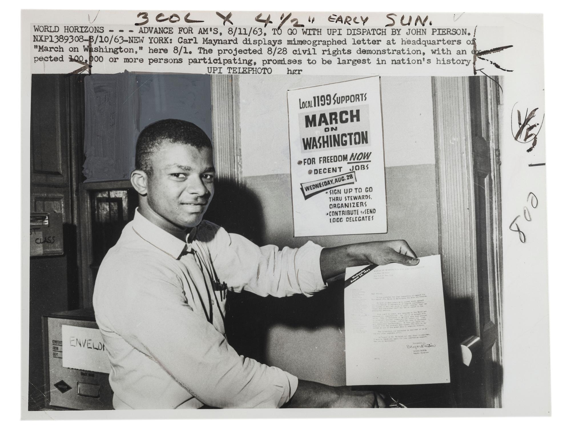 [CIVIL RIGHTS]. Press photograph of Carl Maynard, a young African American at the March on Washington headquarters, posed with letter and poster promoting the upcoming demonstration. New York, 11 August 1963.