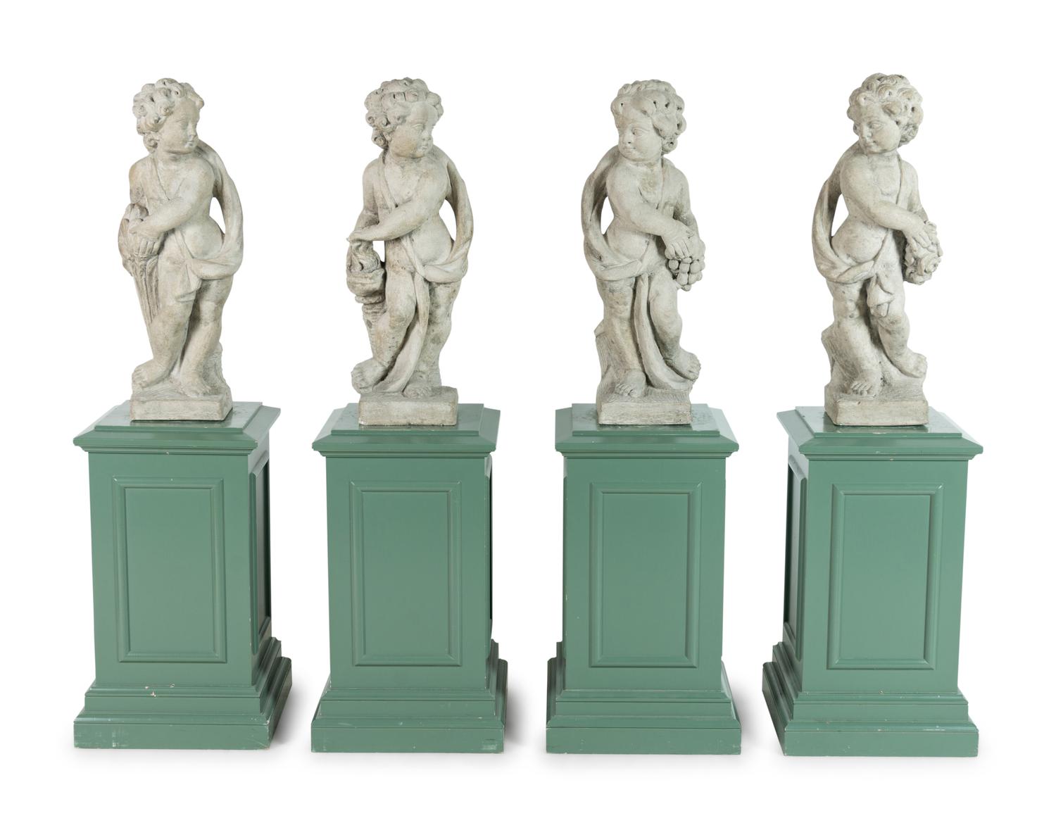 A Set of Four Composition Putti