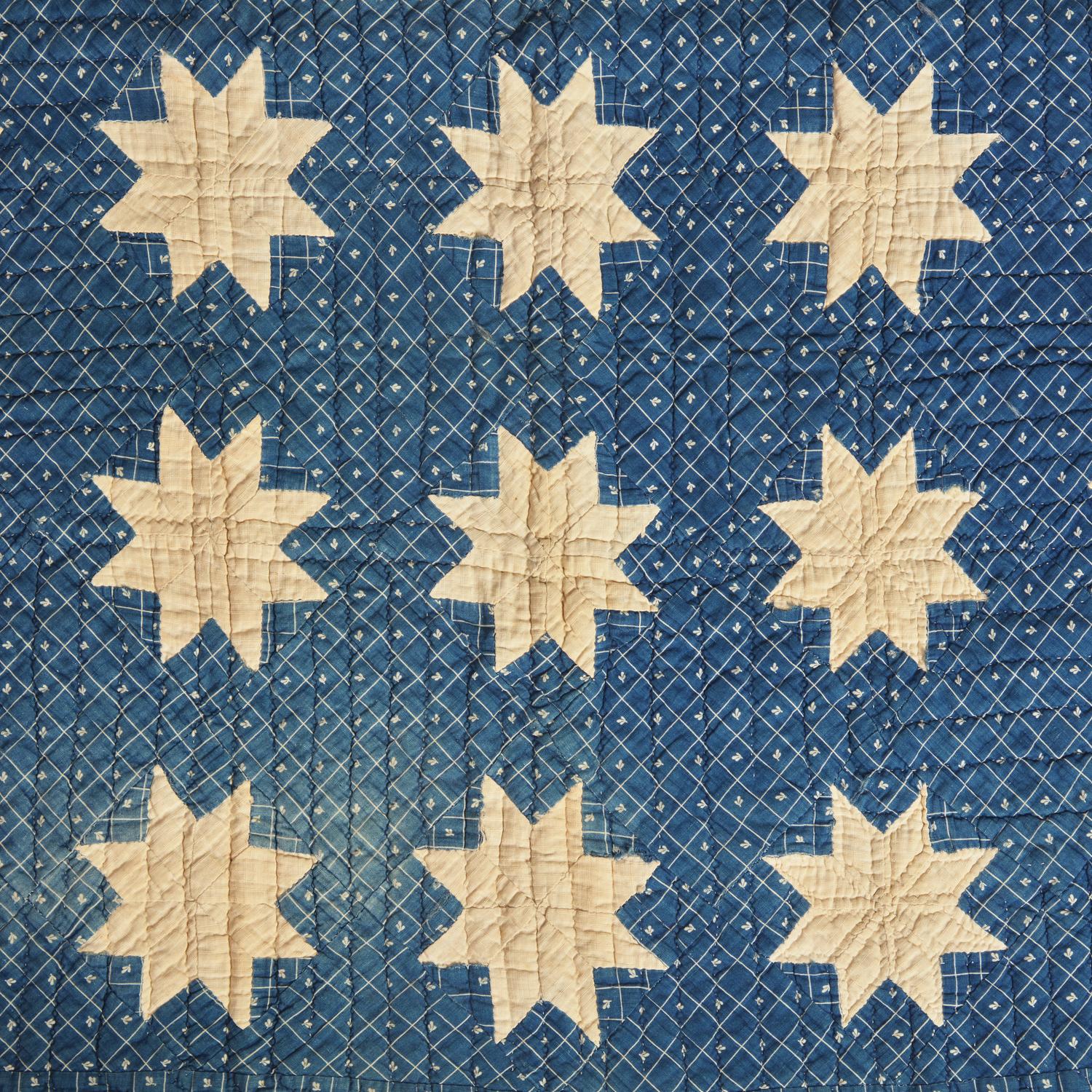 A Pieced Cotton Blue and White "Stars" Crib Quilt