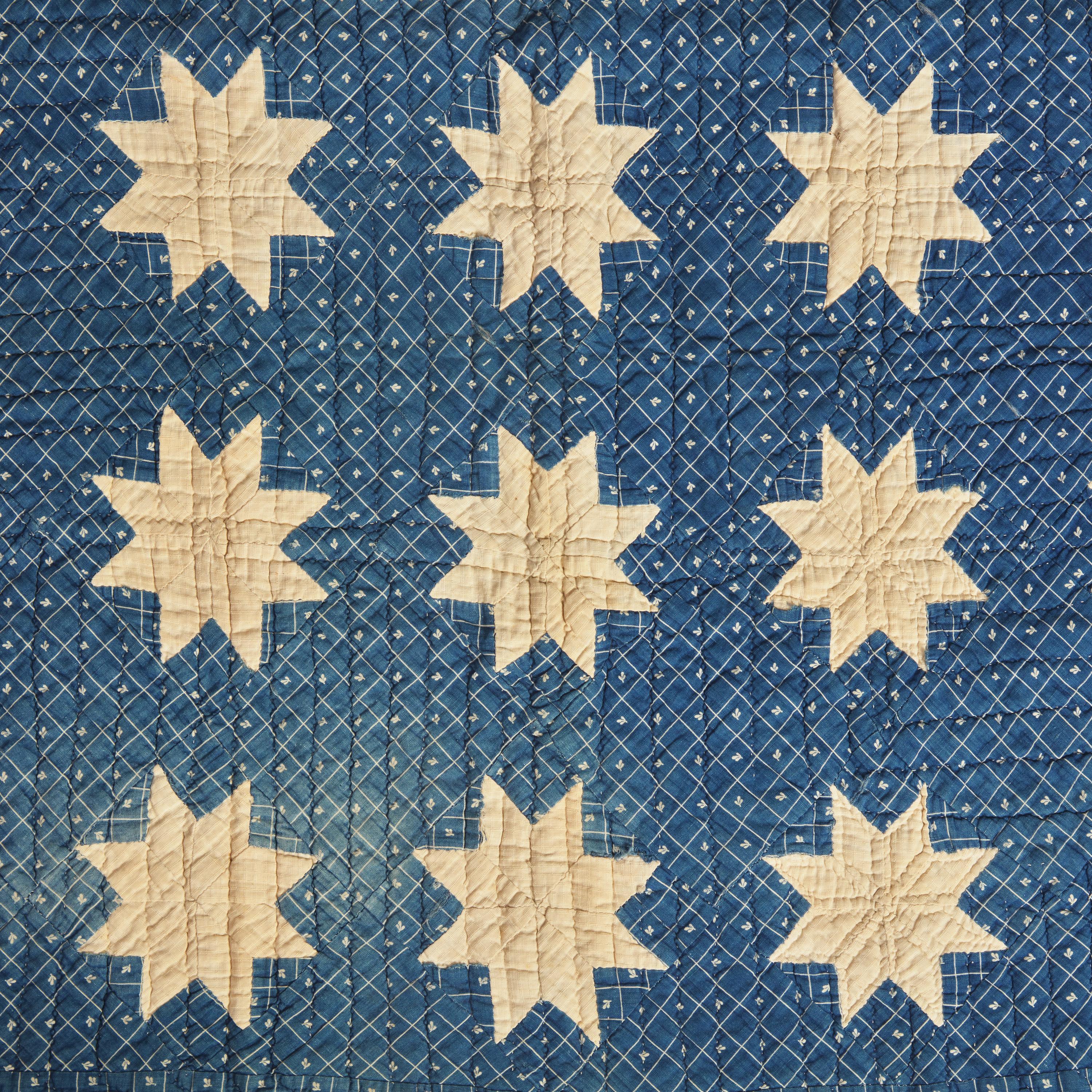 A Pieced Cotton Blue and White "Stars" Crib Quilt