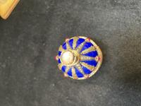 A 14 Karat Vari-Color Gold, Guilloché Enamel, Diamond, and Cabochon Jewel-Mounted Egg-Form Perfume and a Related Guilloché Enamel, 14 Karat Vari-Color Gold, Diamond, and Cabochon-Mounted Surprise Egg