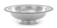 An American Silver Center Bowl, Tiffany & Co., New York, NY, the rim worked to show foliate banding, raised on a stepped circular foot.