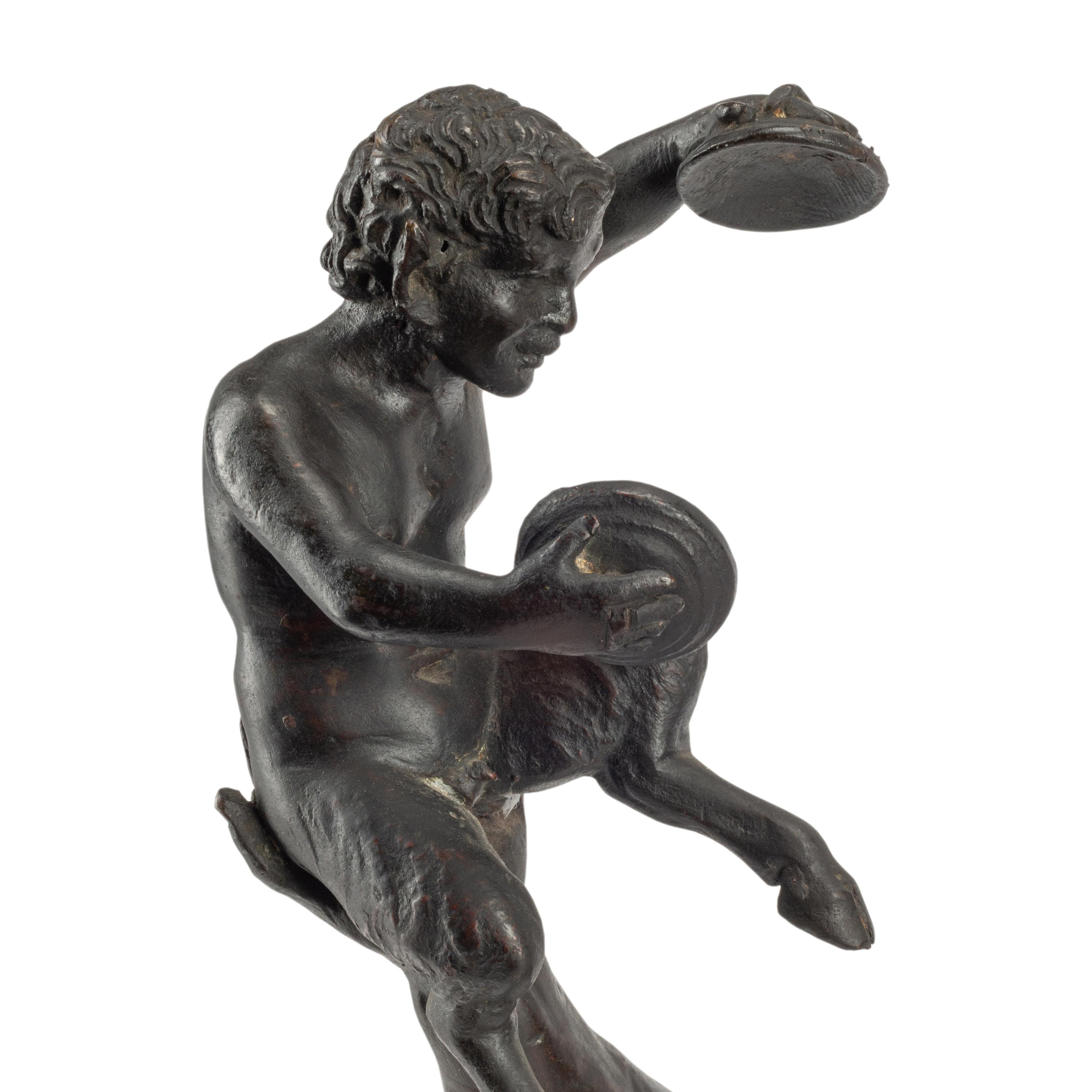A Patinated Bronze Figure of Pan with a Faun