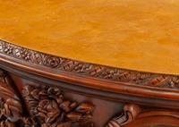 A Continental Floral-Carved and Painted Wood Commode