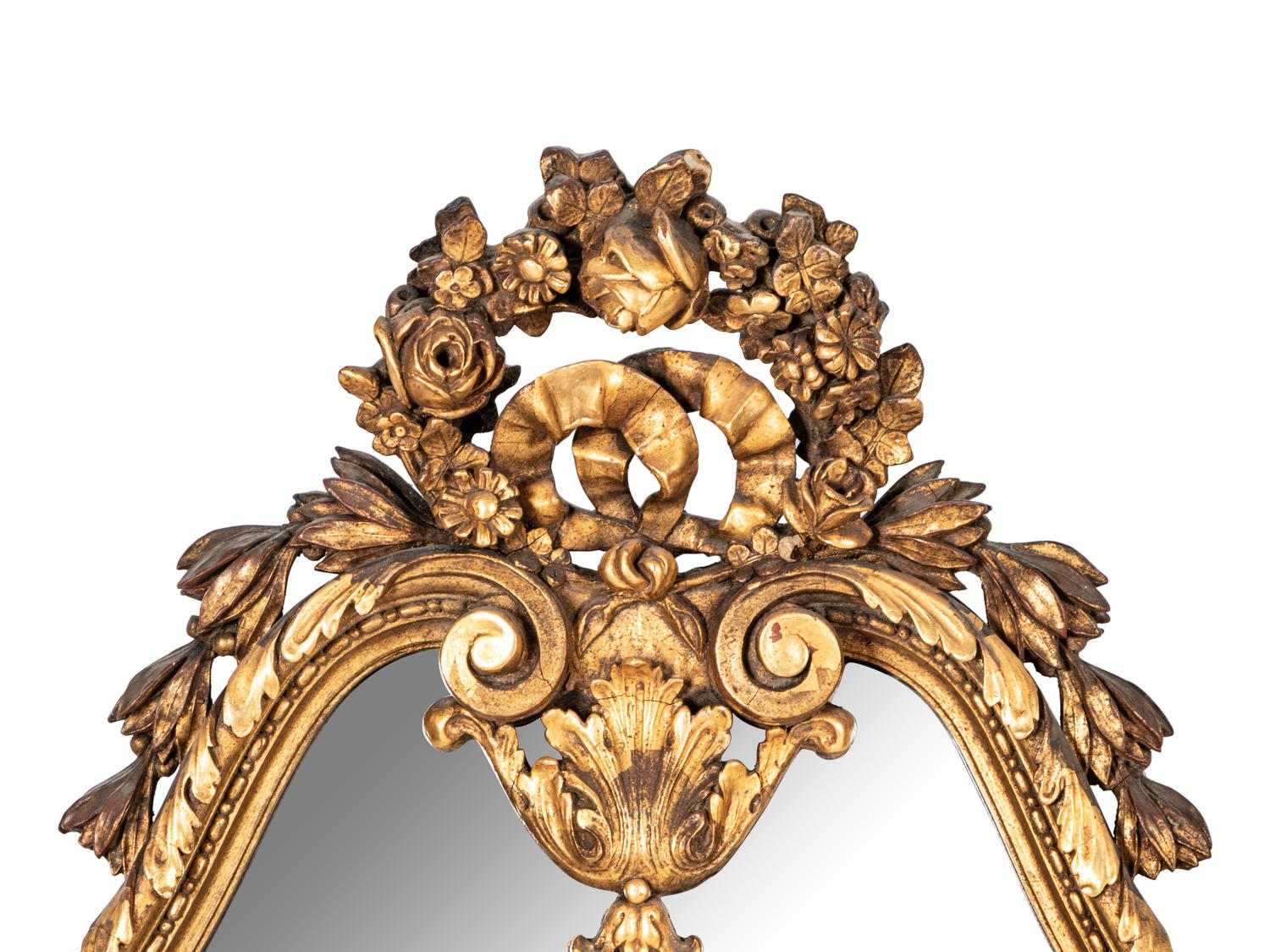 An Italian Baroque Style Giltwood Mirror