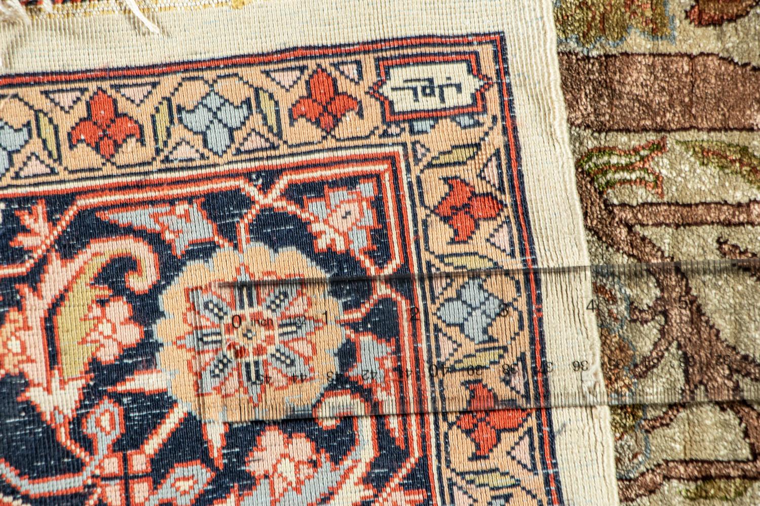 A Kashan Silk Rug
