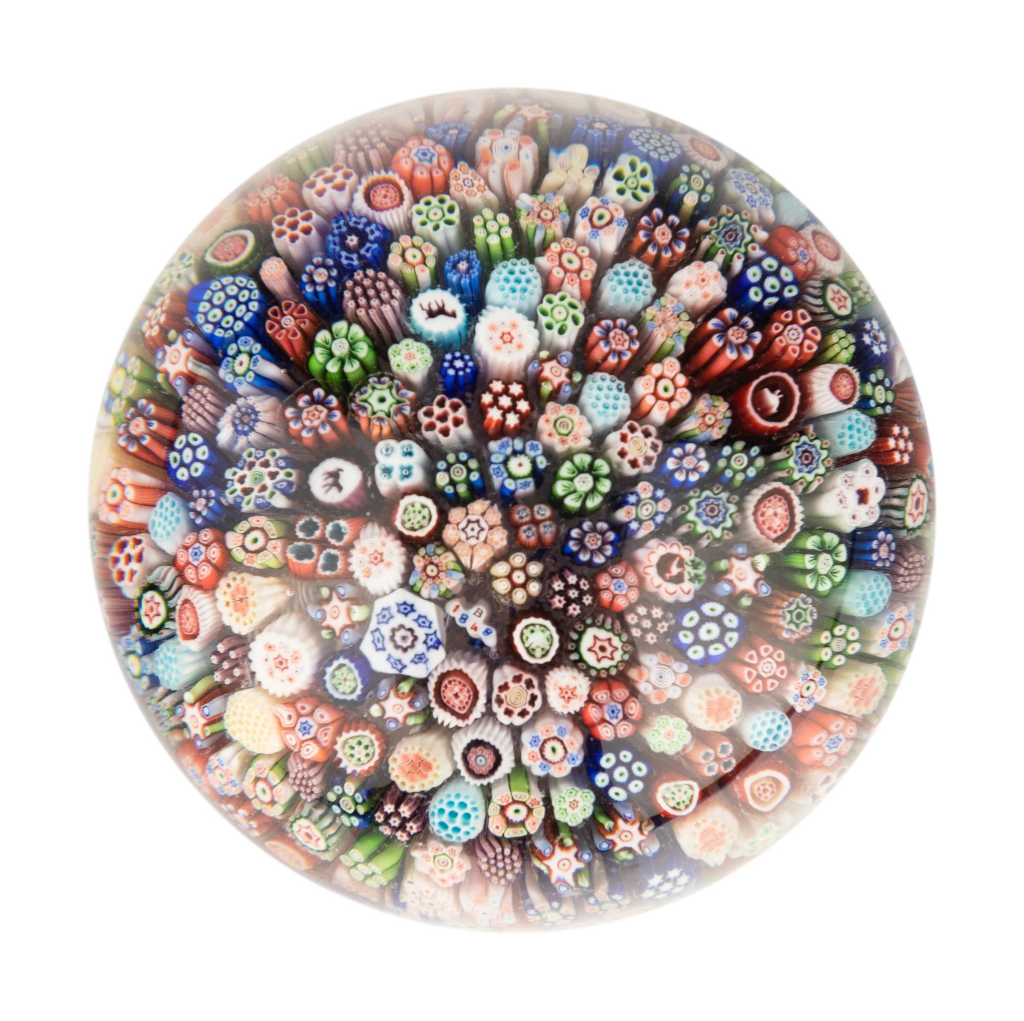 A Baccarat Close Packed Millefiori and Silhouette Glass Paperweight