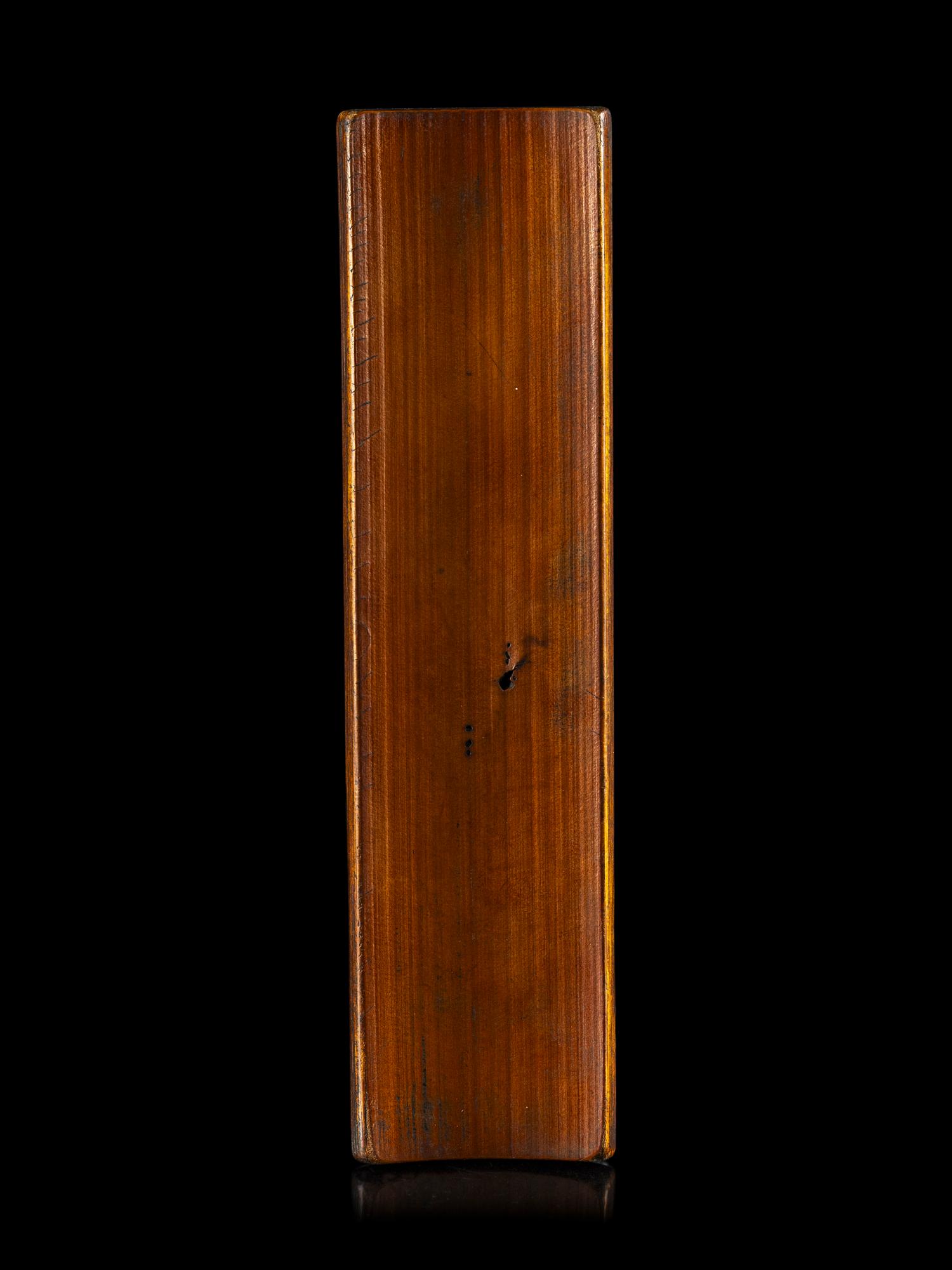 A Chinese Carved Bamboo 'Lotus and Crab' Wrist Rest