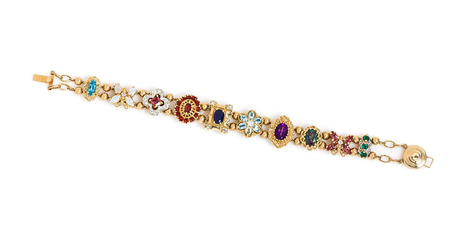 A 14 Karat Yellow Gold and Multigem Slide Charm Bracelet, 20.40 dwts.